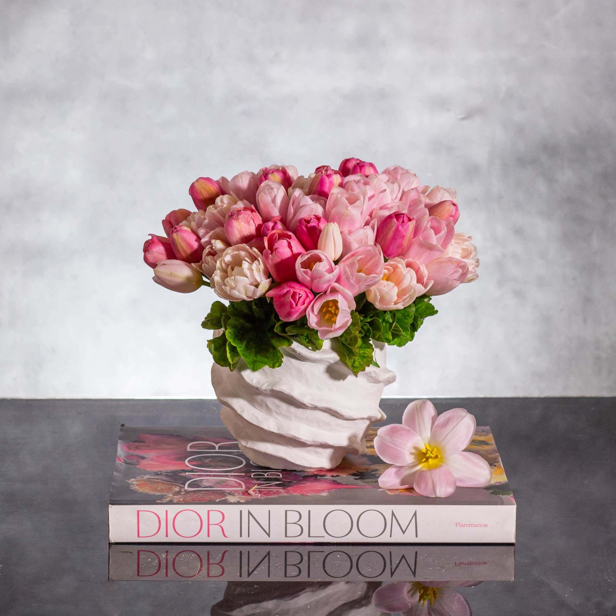 Embrace the essence of spring with our exquisite arrangement featuring 50 pink