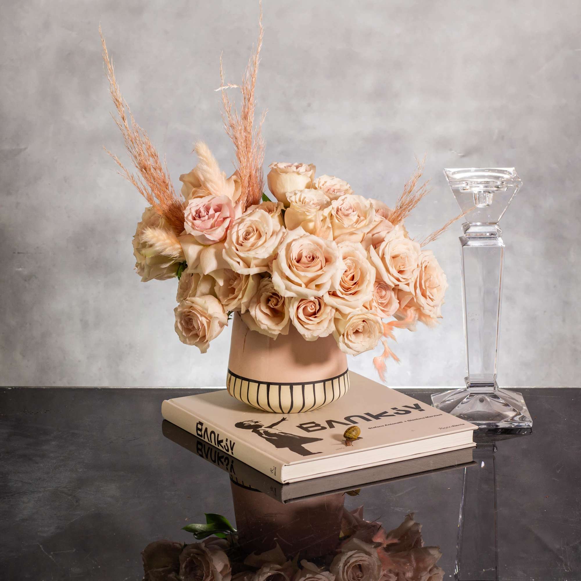 The sand color roses are elegantly displayed in a modern 6-inch tall