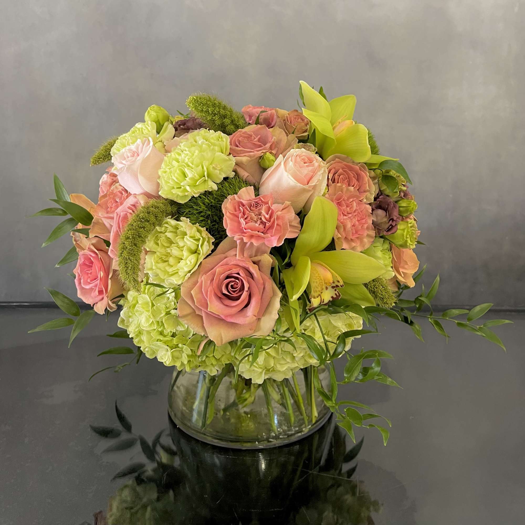 A mini version of a pink Rose Garden. This arrangement consists of
