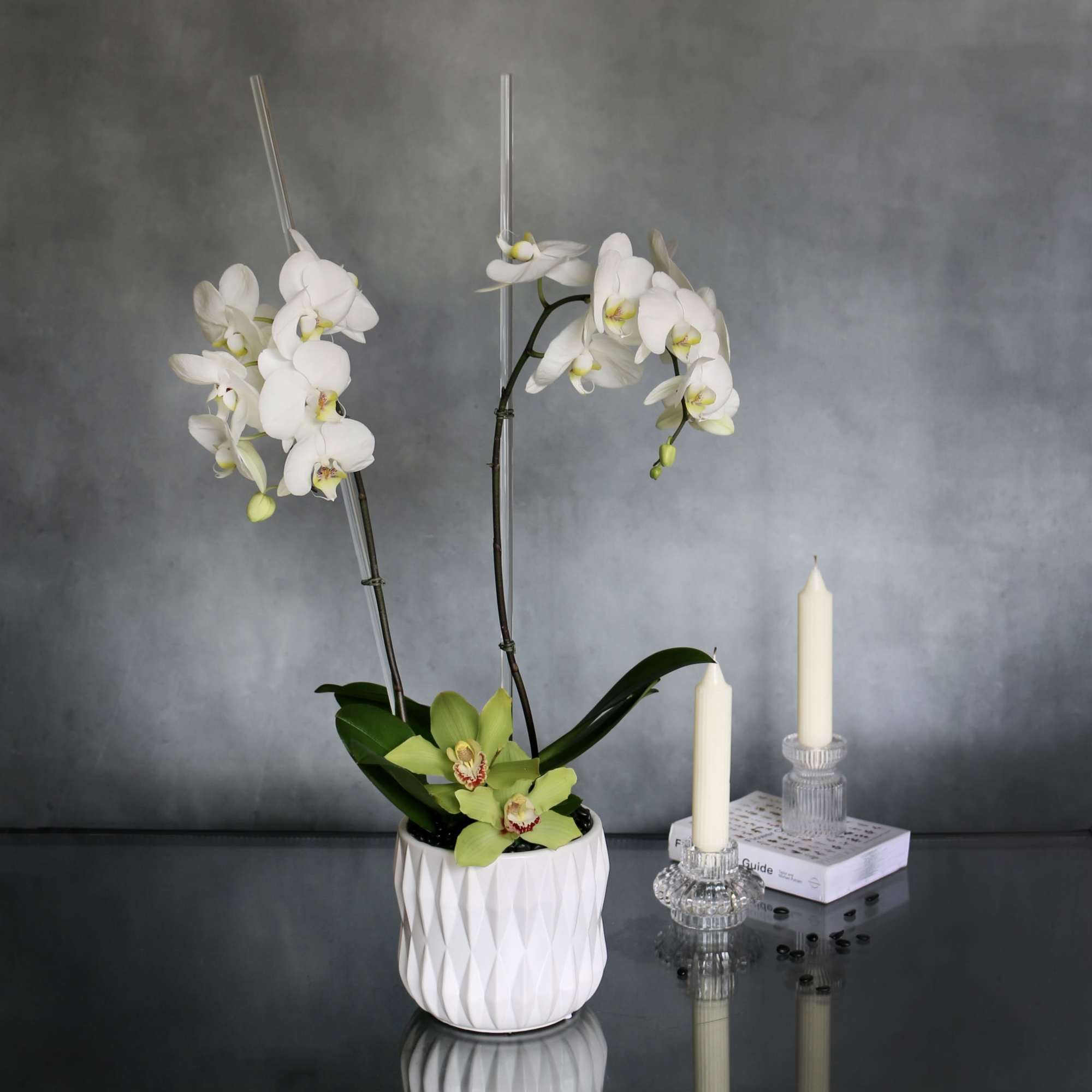 Our Orchid piece consists of two simple white Orchids accented with green