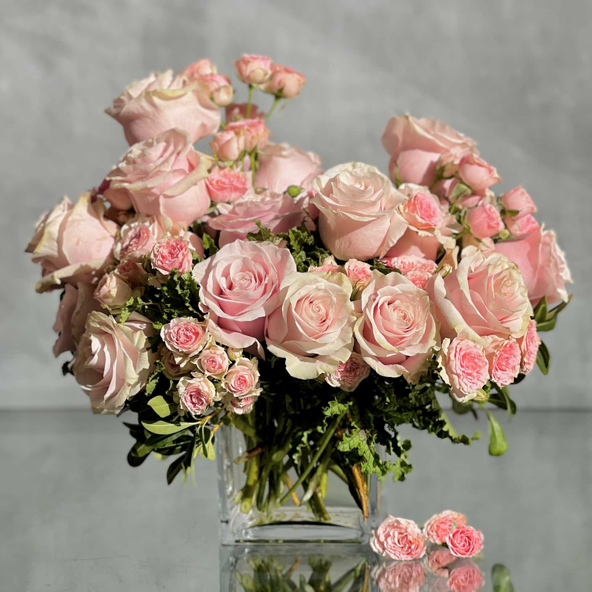 Delight in the luxurious and feminine beauty of our exquisite floral arrangement
