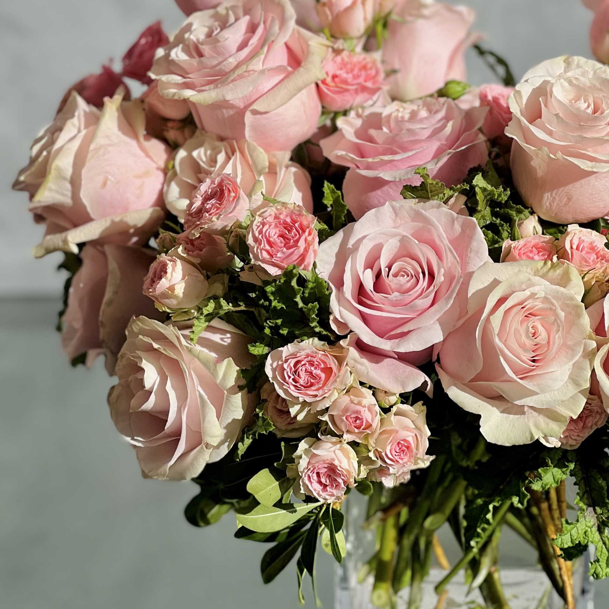 Delight in the luxurious and feminine beauty of our exquisite floral arrangement