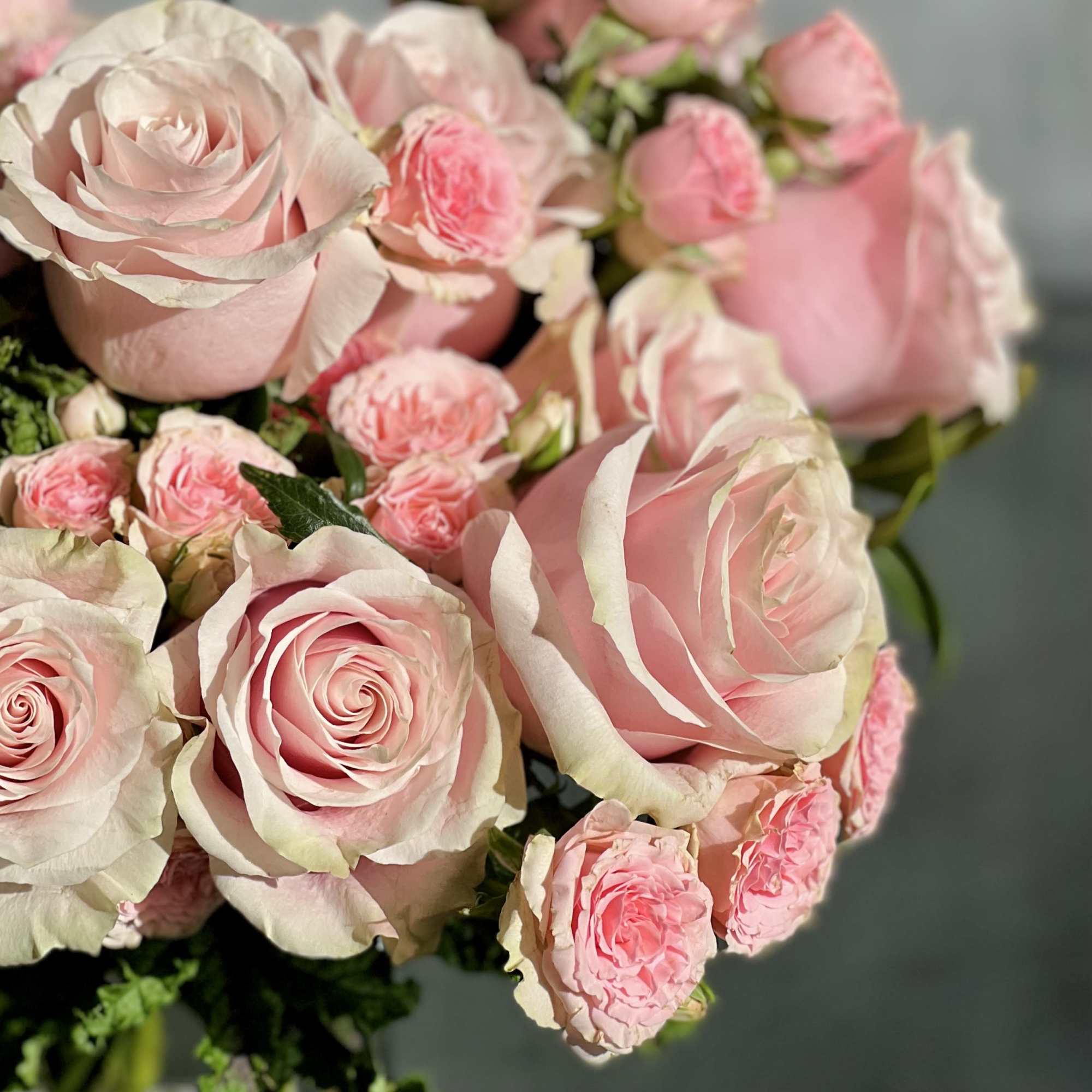 Delight in the luxurious and feminine beauty of our exquisite floral arrangement