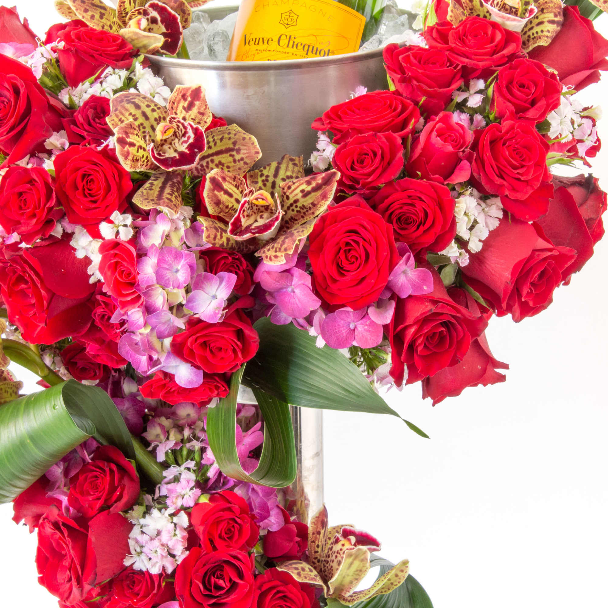 Charming floral wine bucket and stand incorporate with dramatic roses, orchids, Hydrangeas.