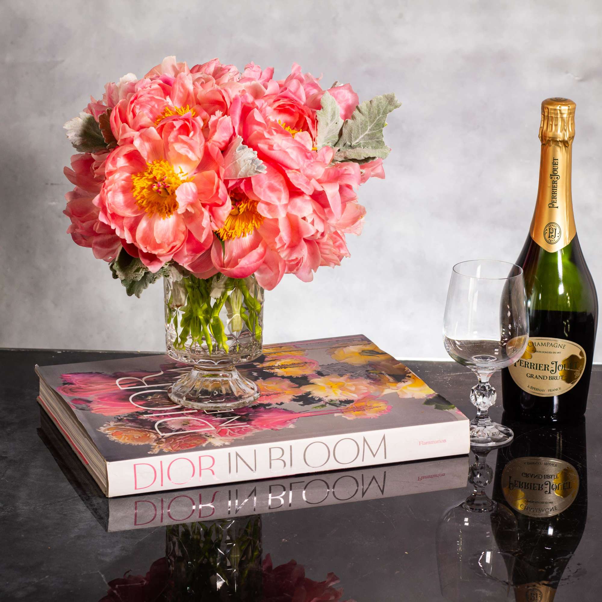 Indulge in the enchanting beauty of our coral color peonies arrangement, delicately