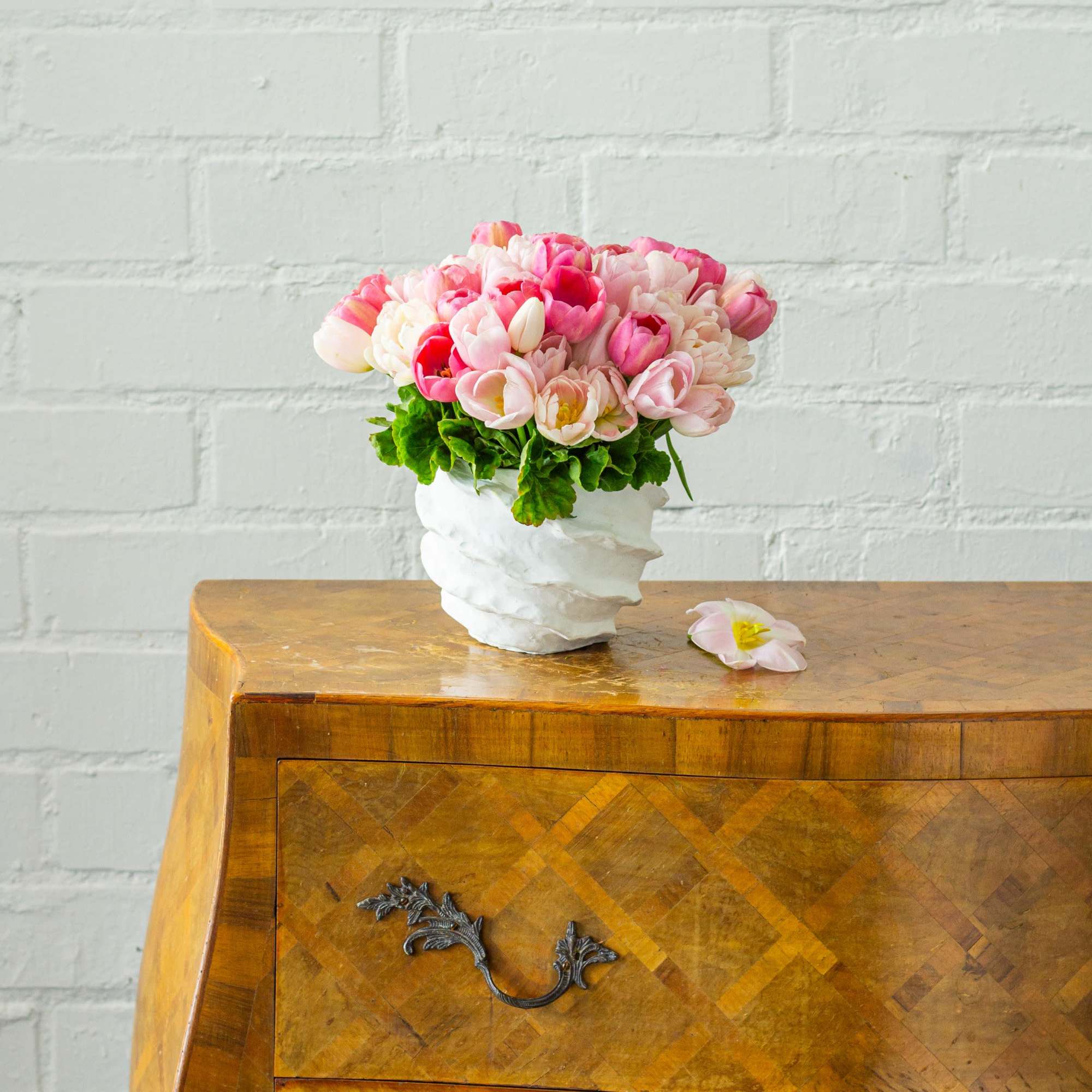 Embrace the essence of spring with our exquisite arrangement featuring 50 pink