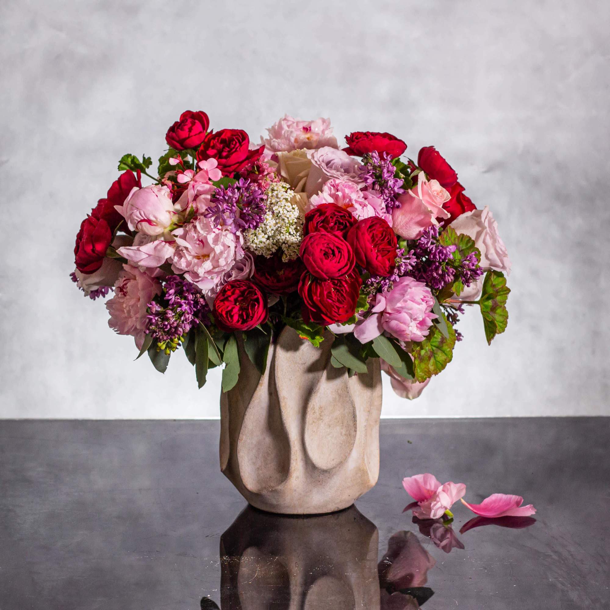 Immerse yourself in a world of seduction with our enchanting floral creation.