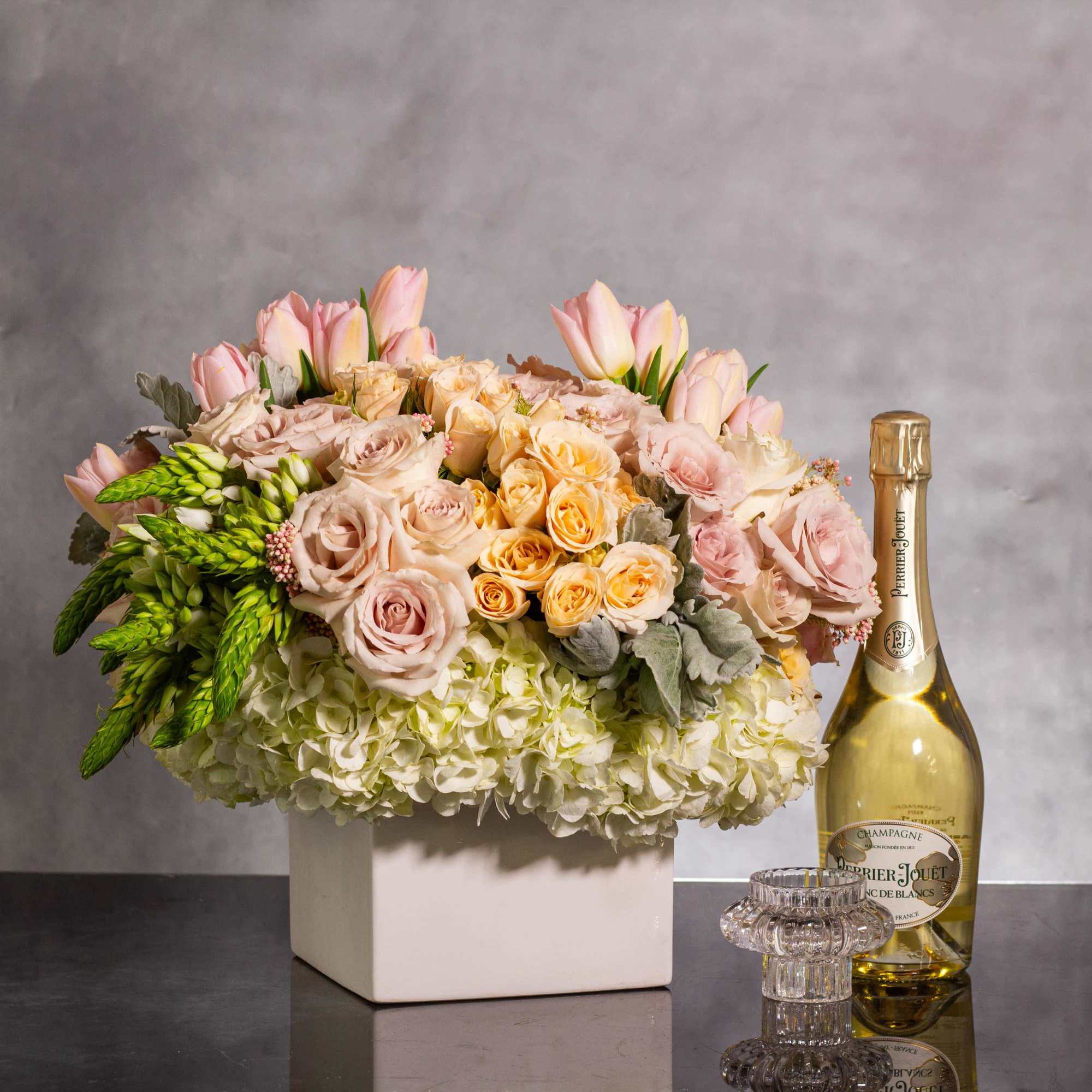  Delight in the gentle beauty of our floral arrangement, featuring soft