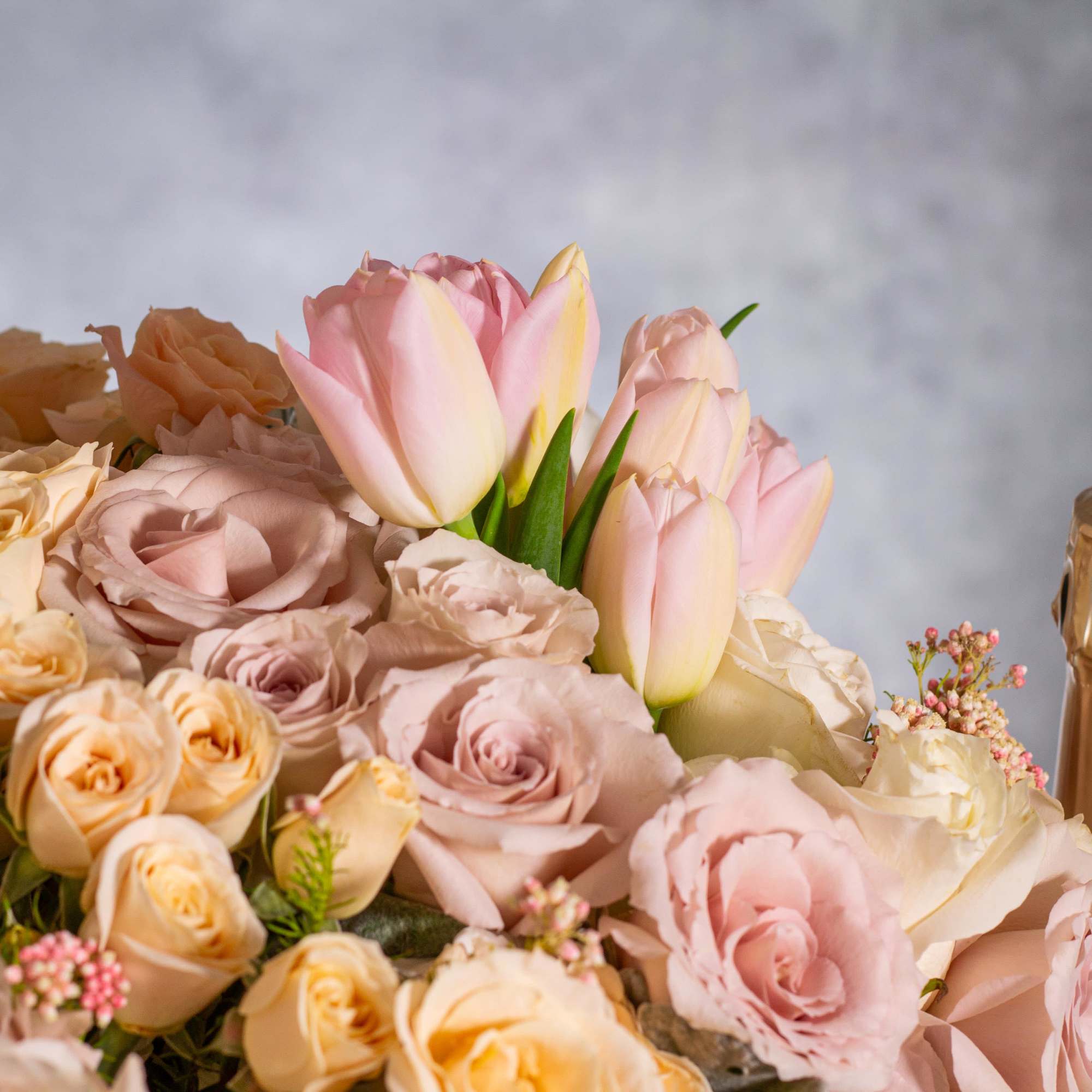  Delight in the gentle beauty of our floral arrangement, featuring soft
