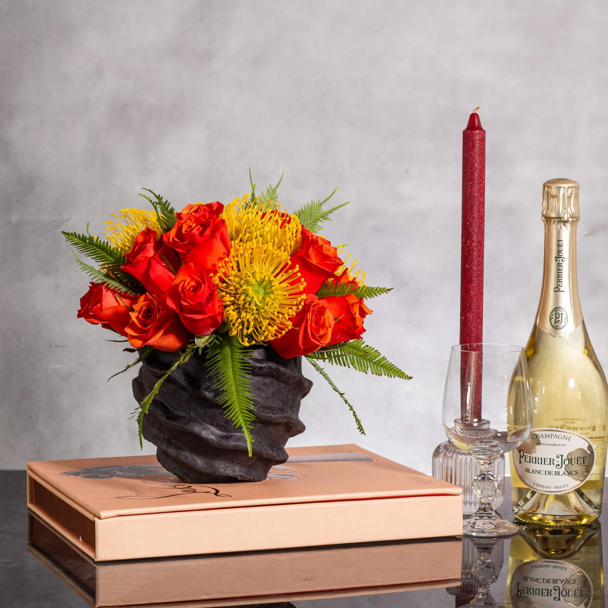 Experience a burst of color with this vibrant arrangement featuring bright orange