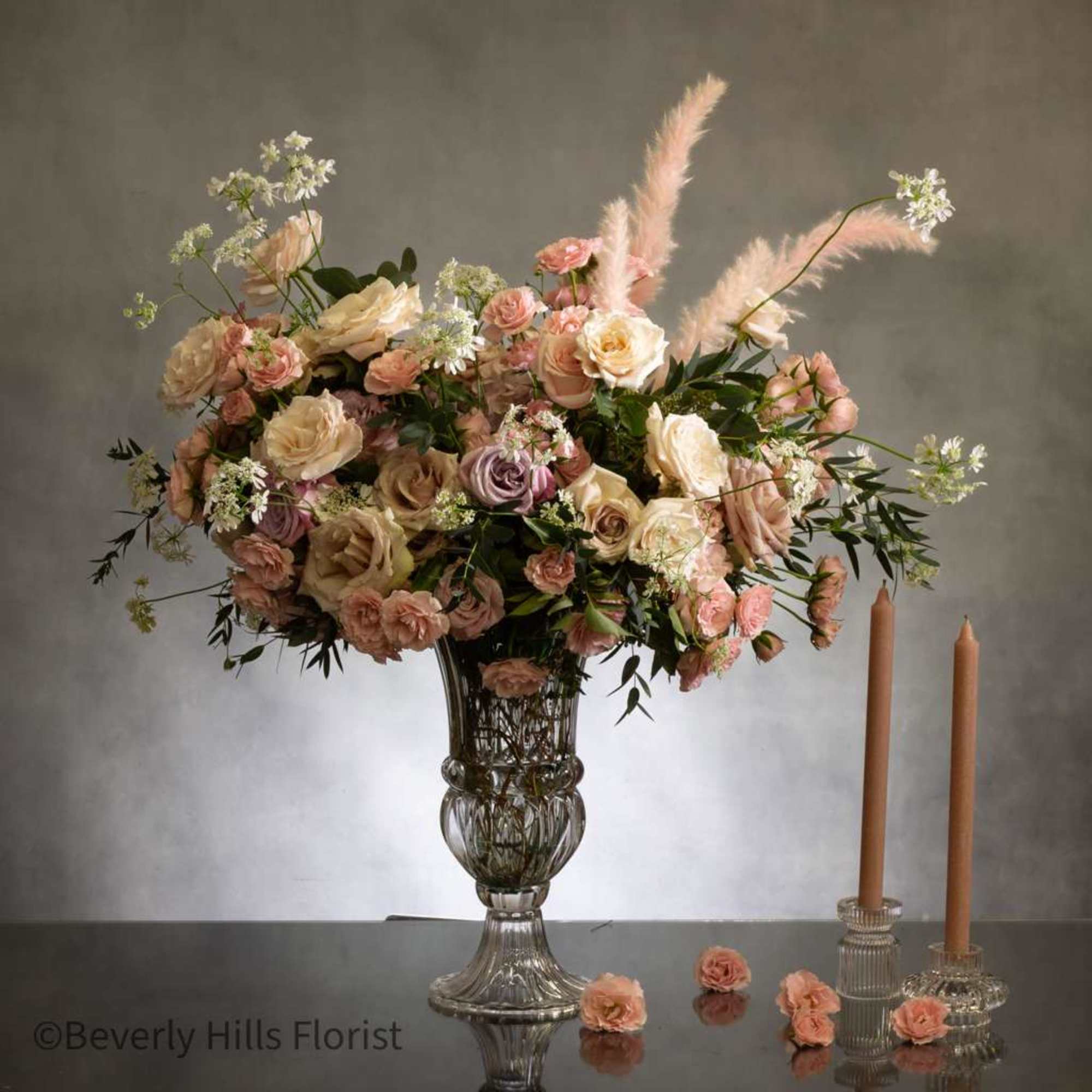 This stunning arrangement boasts over 100 blooms of gorgeous delicate florals, including