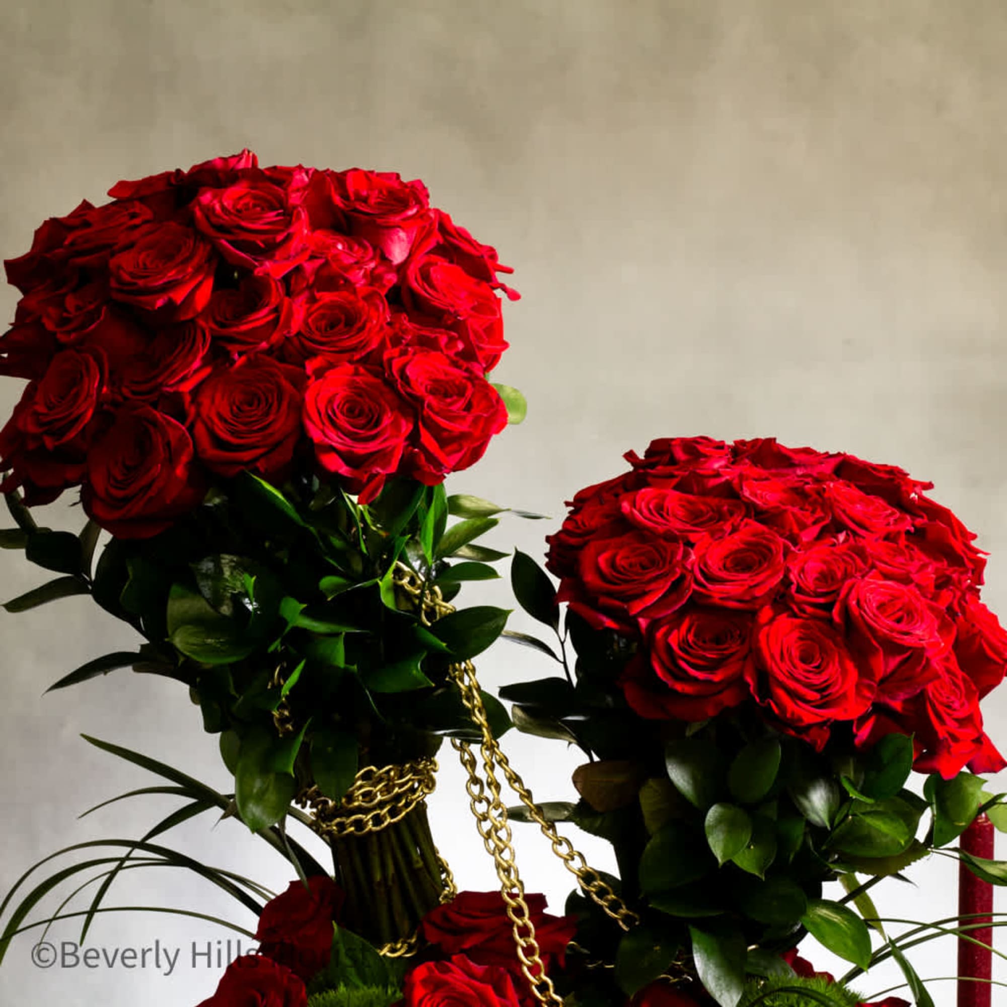 Experience the ultimate luxury with our striking display of red roses, elegantly