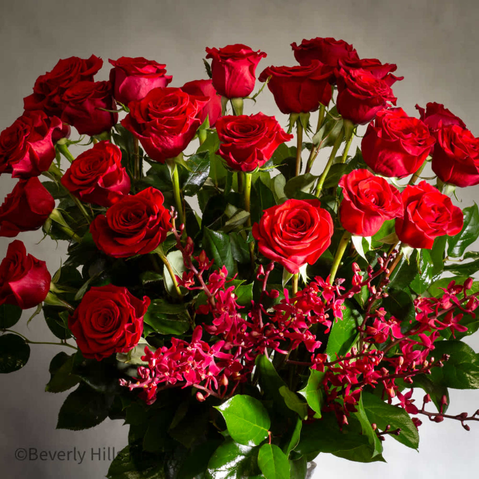 24 Stems of classic roses with orchids