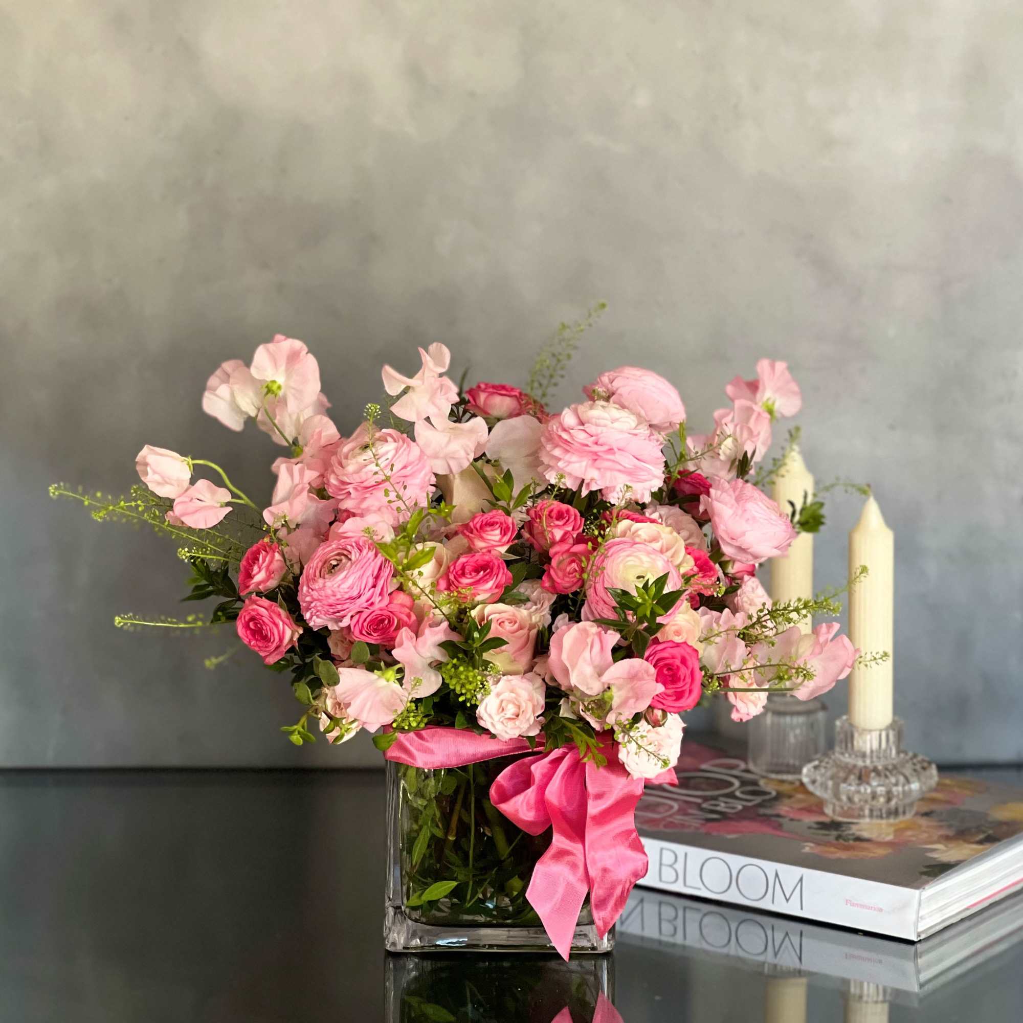 A gorgeous collection of Imported Sweet peas , Dutch Ranunculus and Roses
