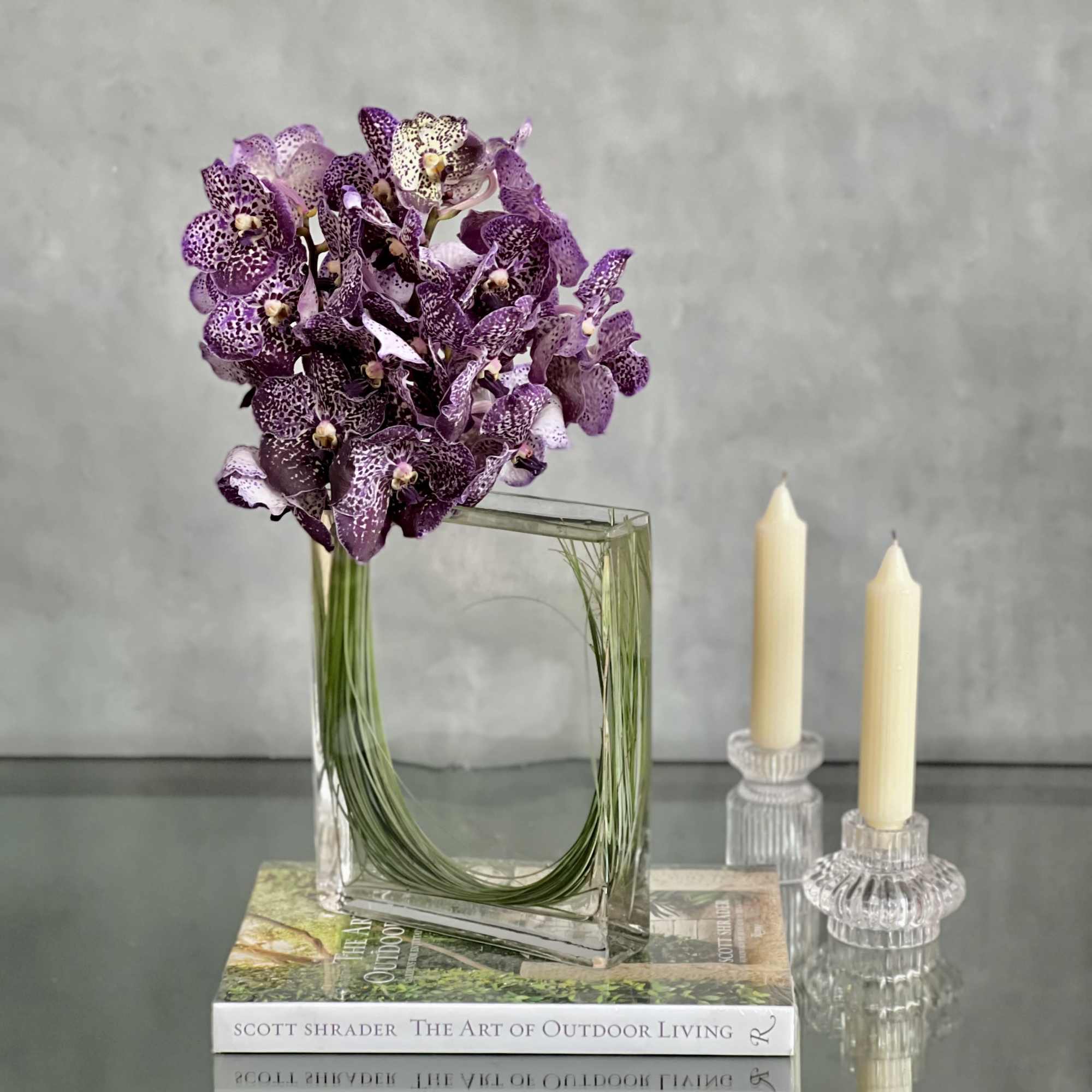 Leopard Like Orchid Blooms in Rectangular Glass Vase. make this display the
