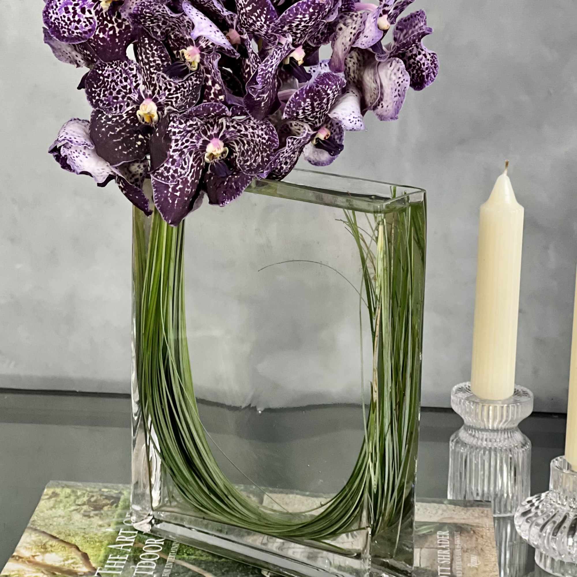 Leopard Like Orchid Blooms in Rectangular Glass Vase. make this display the