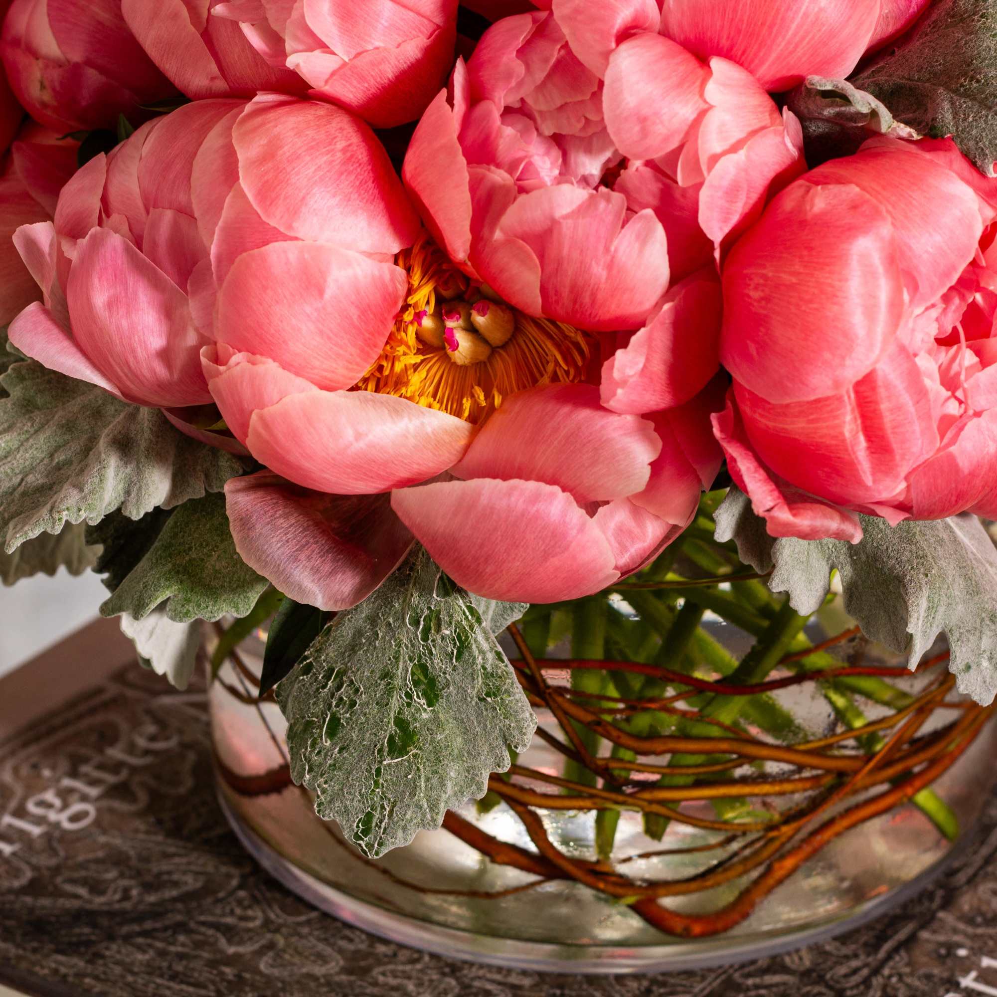 Immerse yourself in a sophisticated floral display featuring coral pink single petal