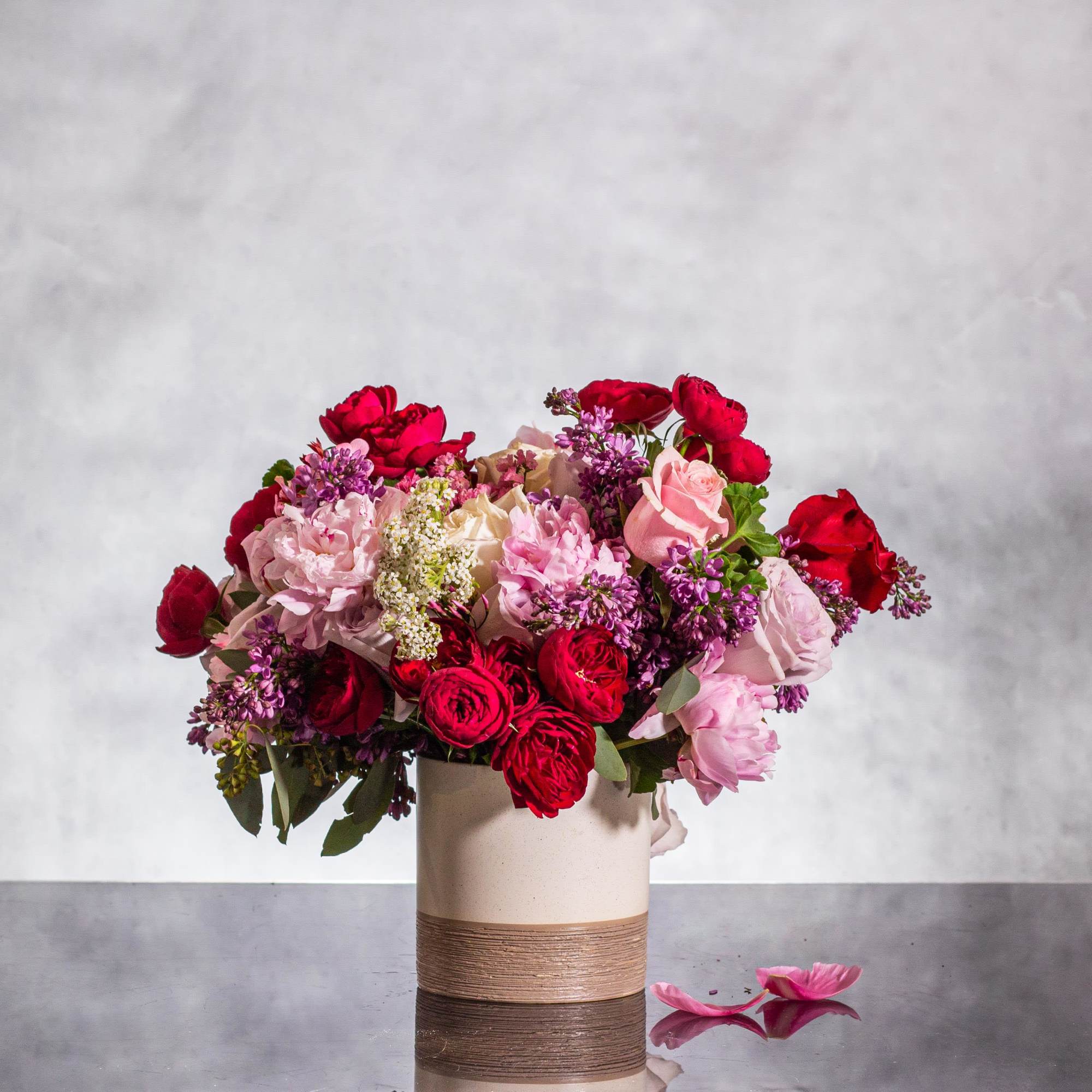 Immerse yourself in a world of seduction with our enchanting floral creation.