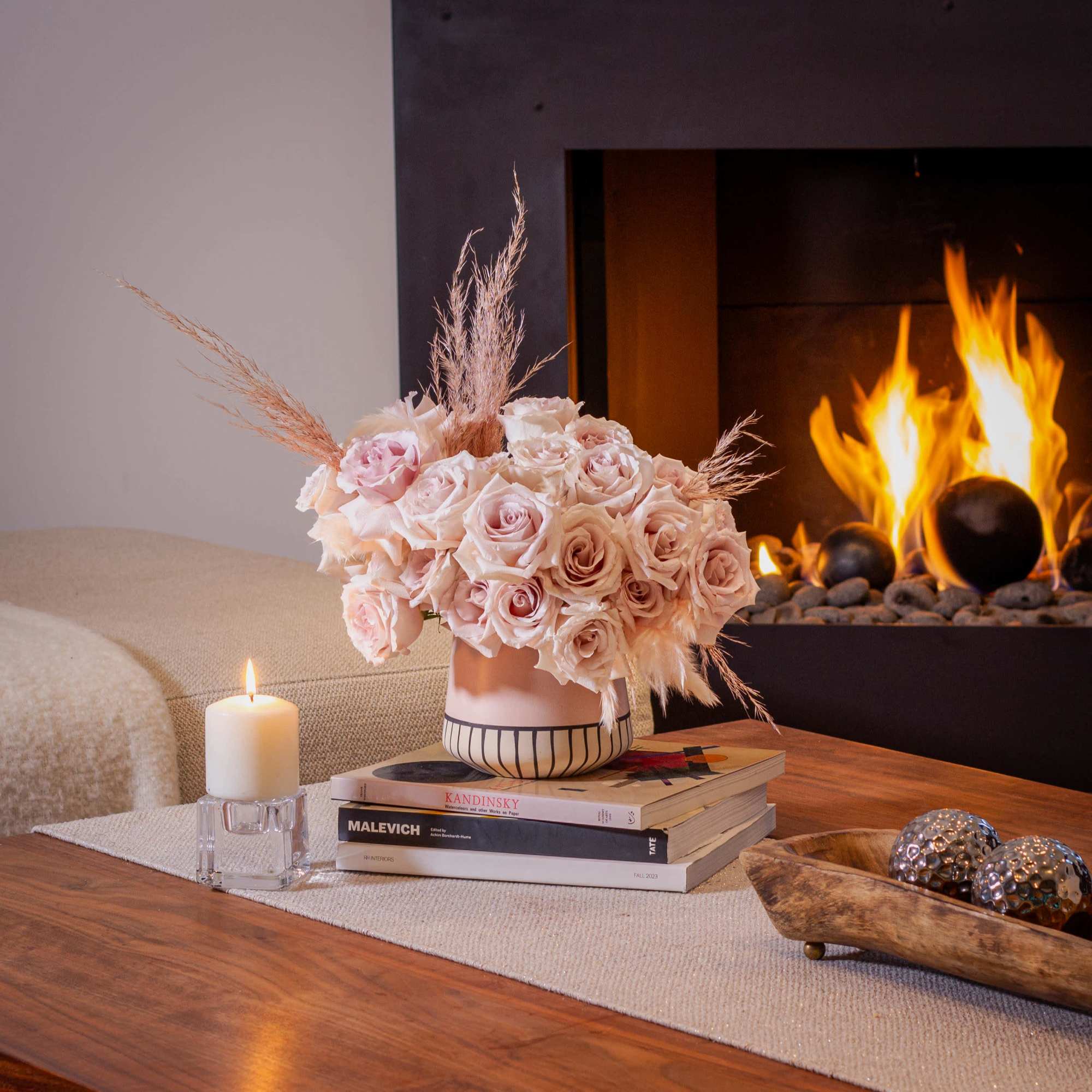 The sand color roses are elegantly displayed in a modern 6-inch tall