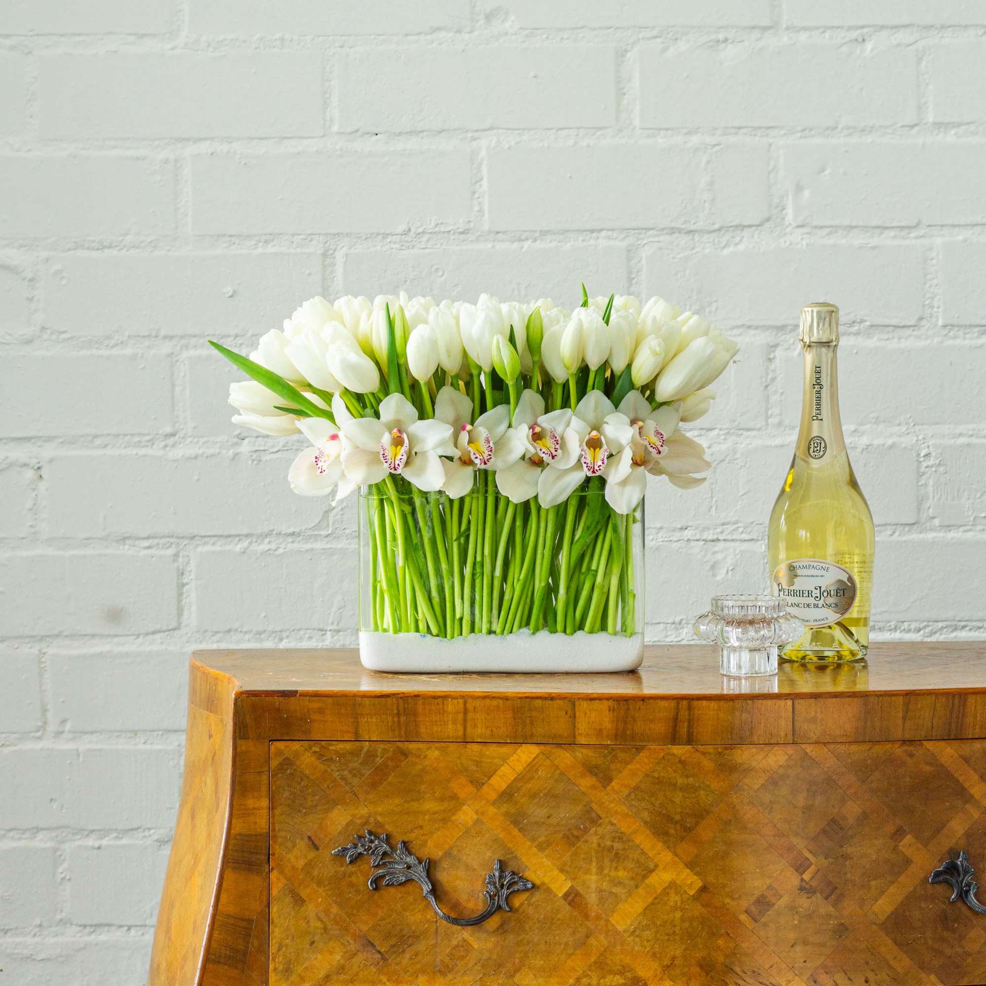 Step into contemporary elegance with this modern floral arrangement featuring over 100