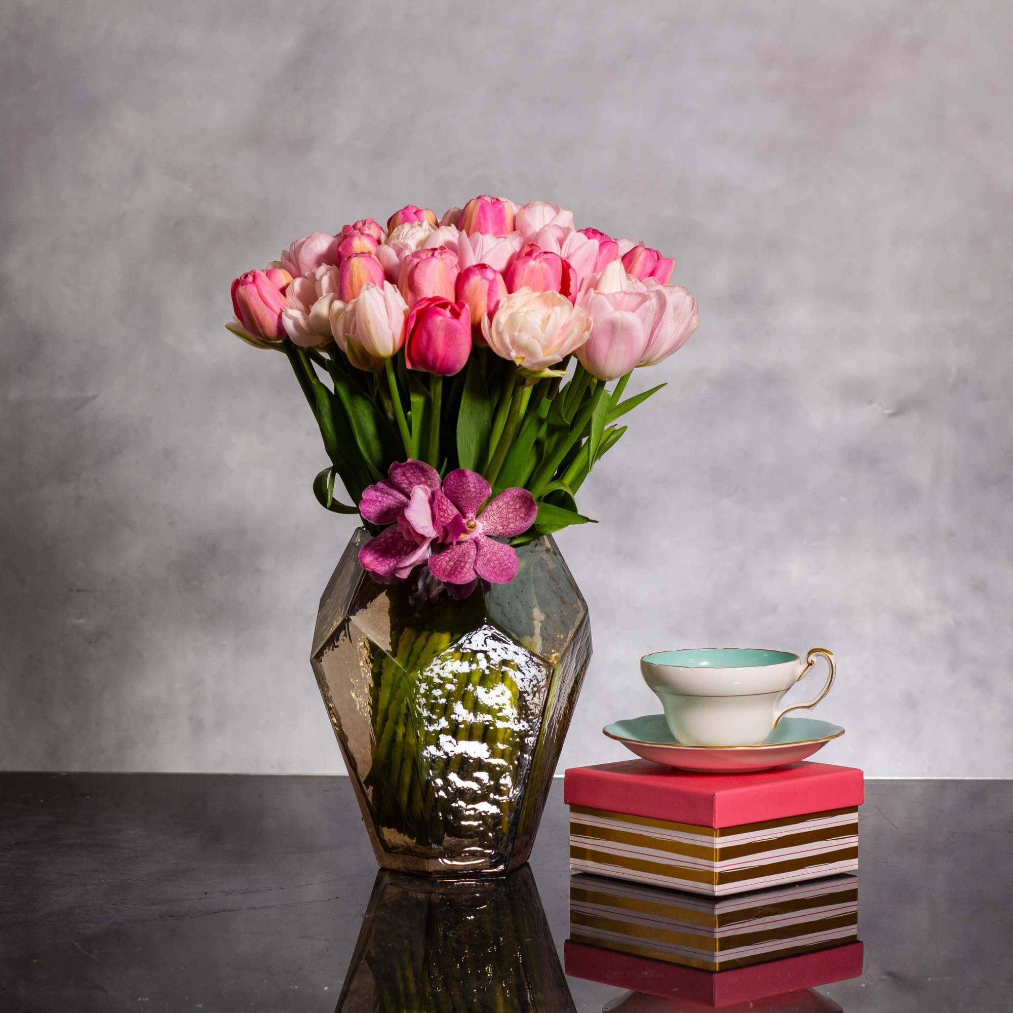 Envision a stunning floral arrangement comprised of fifty light pink and various