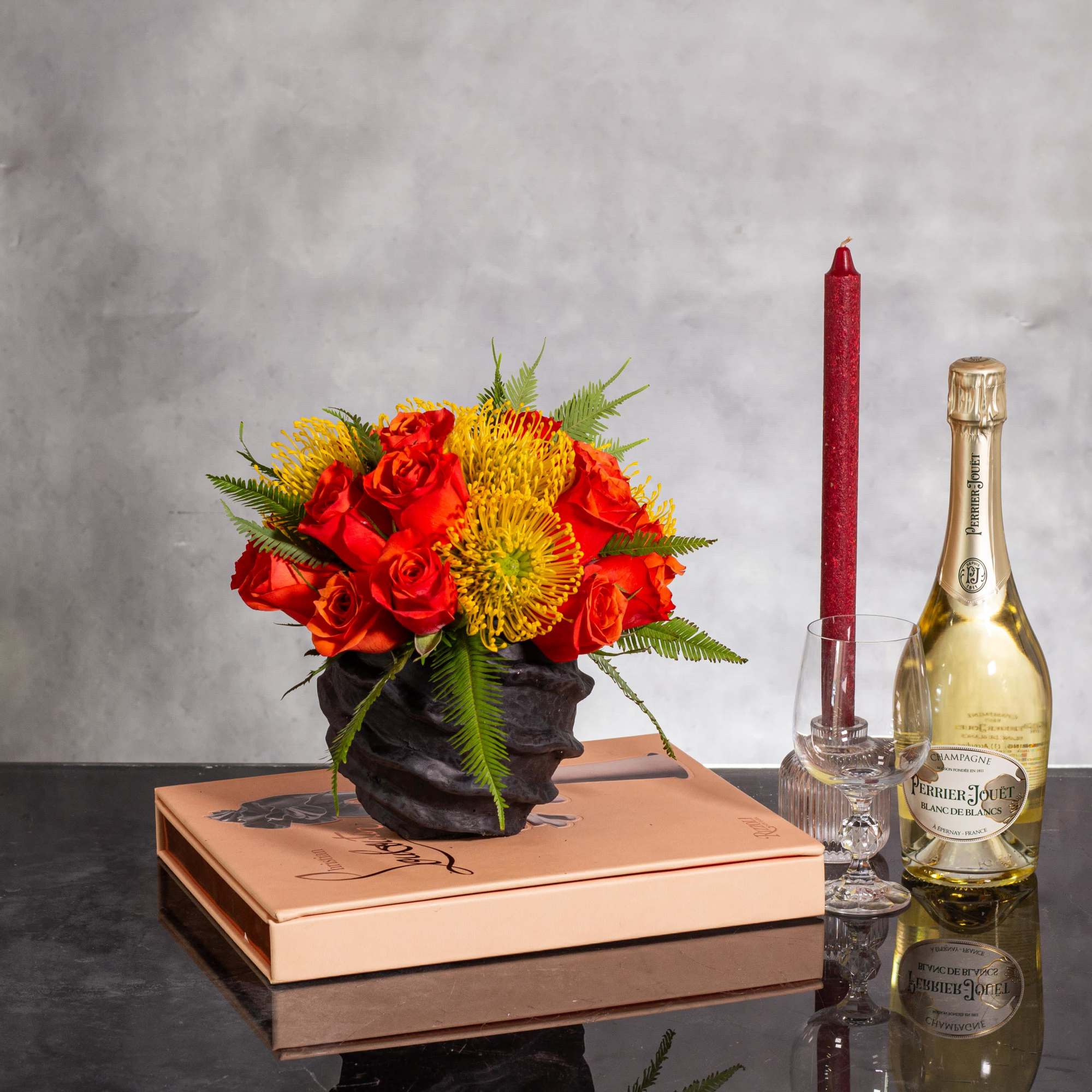 Experience a burst of color with this vibrant arrangement featuring bright orange