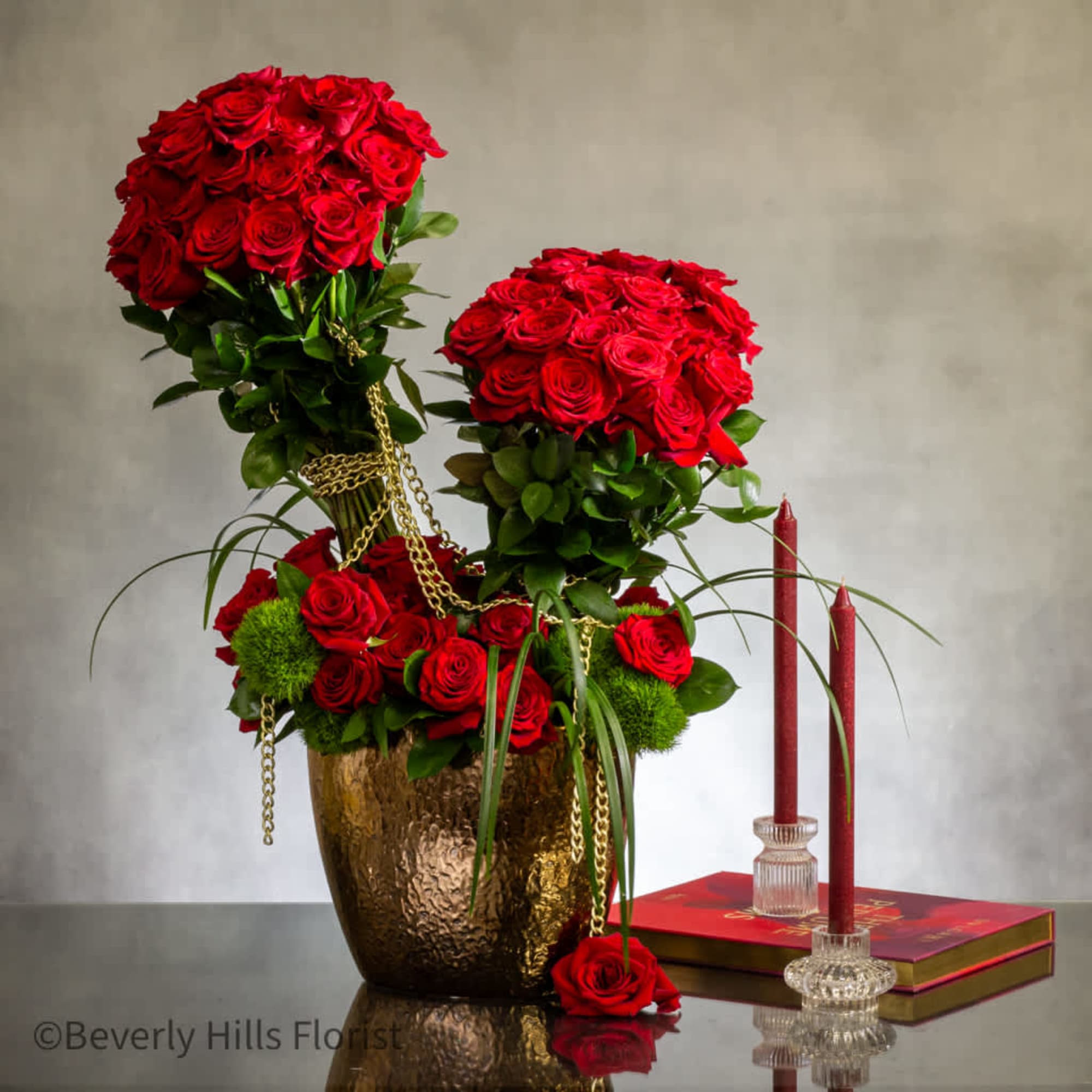 Experience the ultimate luxury with our striking display of red roses, elegantly