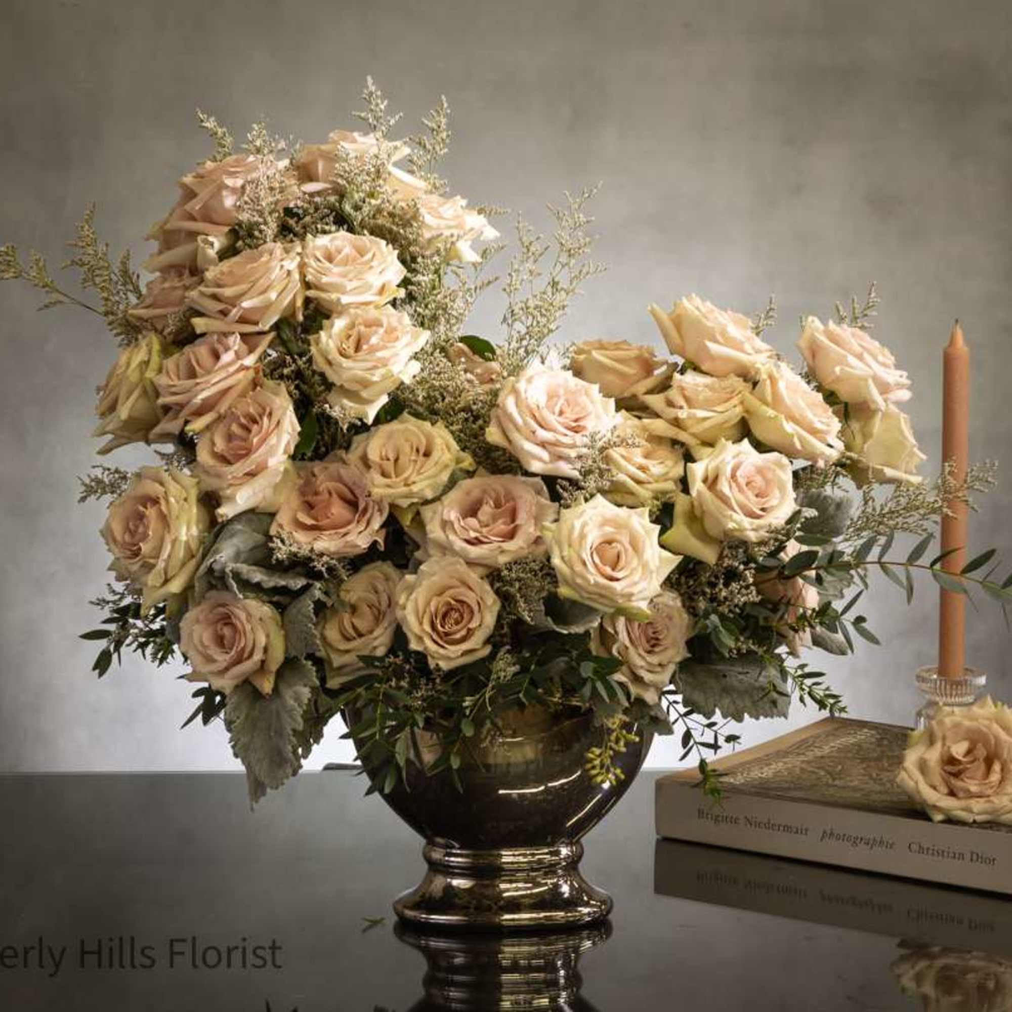 Experience sophistication with a breathtaking arrangement of fifty opulent sand-colored roses in