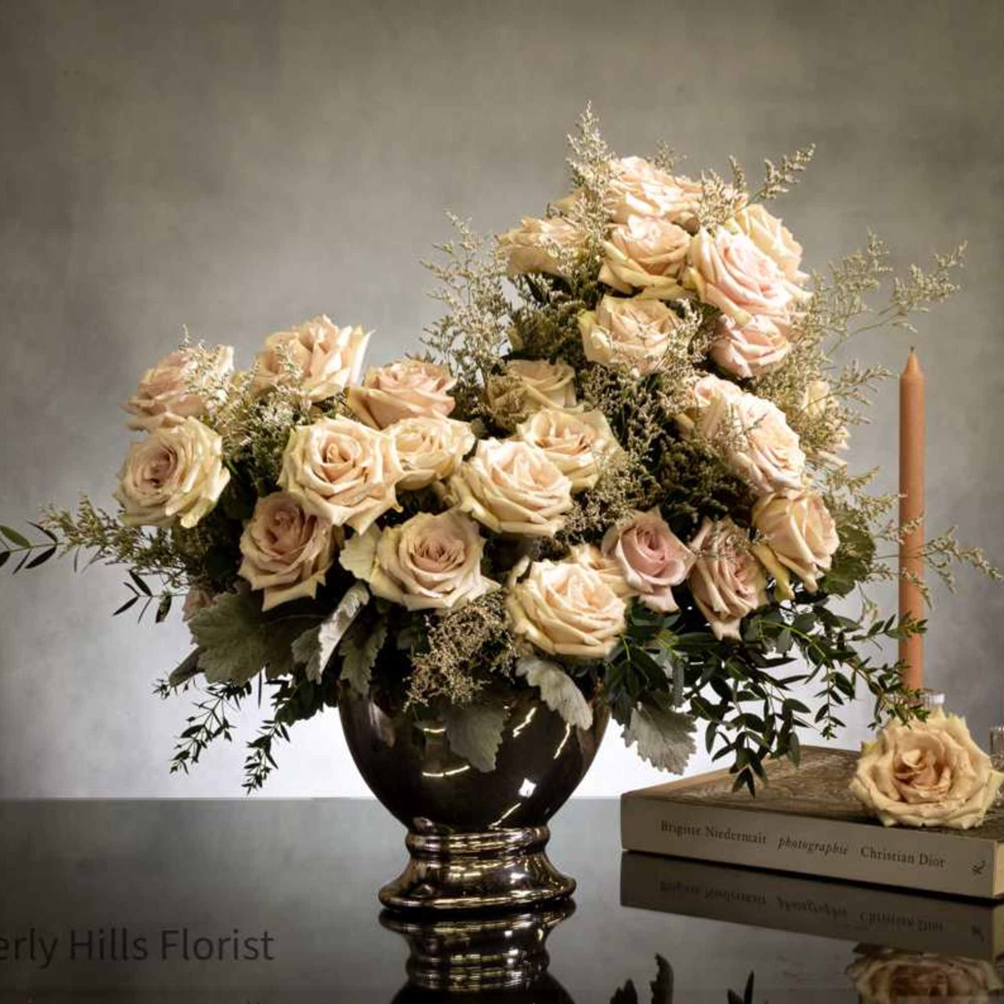 Experience sophistication with a breathtaking arrangement of fifty opulent sand-colored roses in