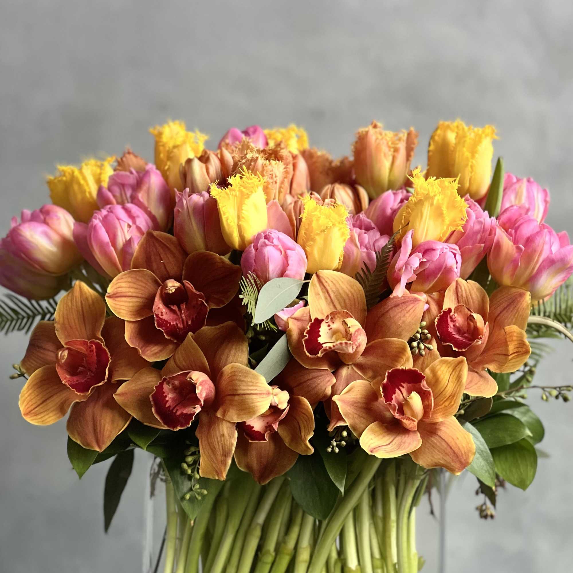 A modern twist to a classic flower! Various shades of colorful Tulips
