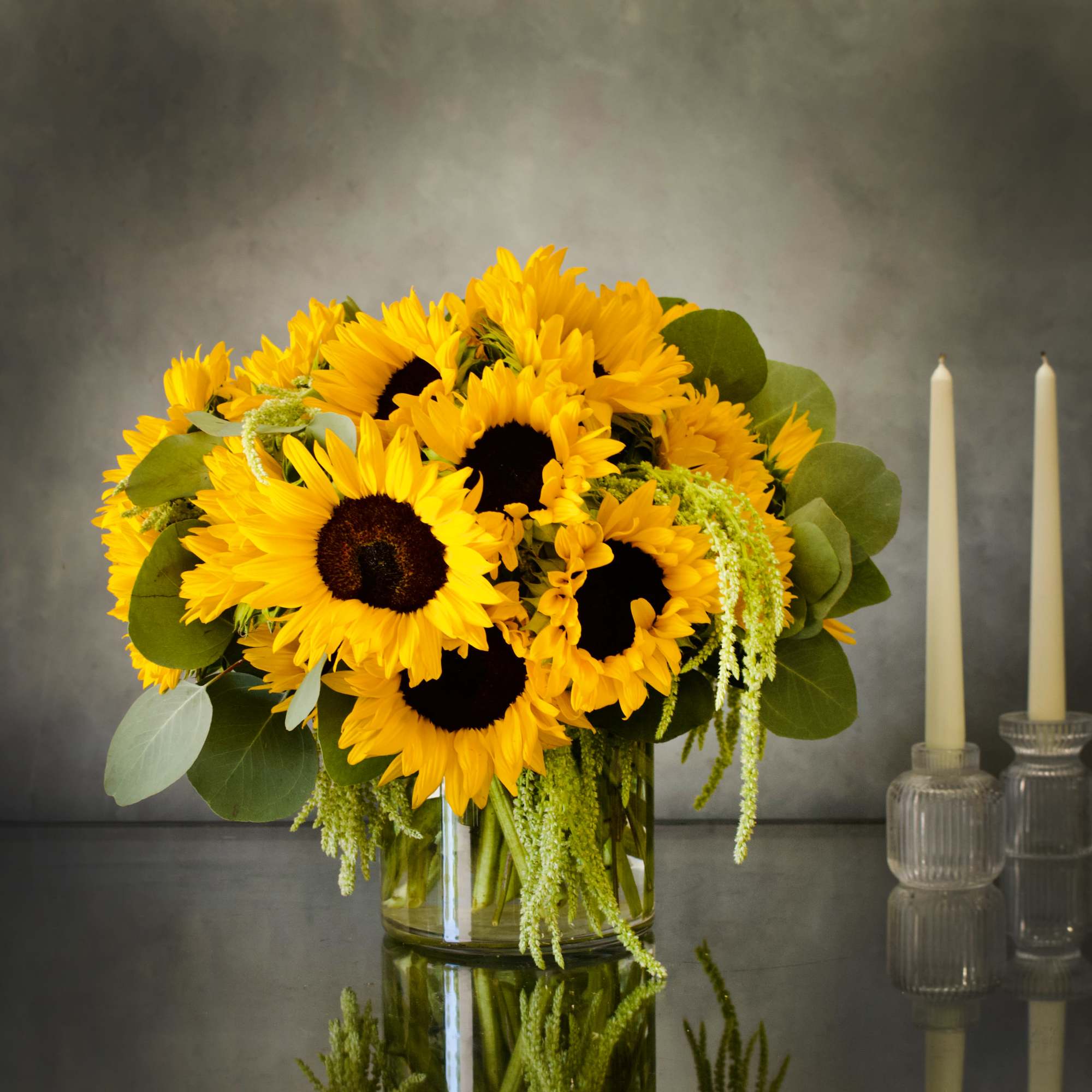 A bright arrangement of Sunflowers ! A classic with a beautiful green