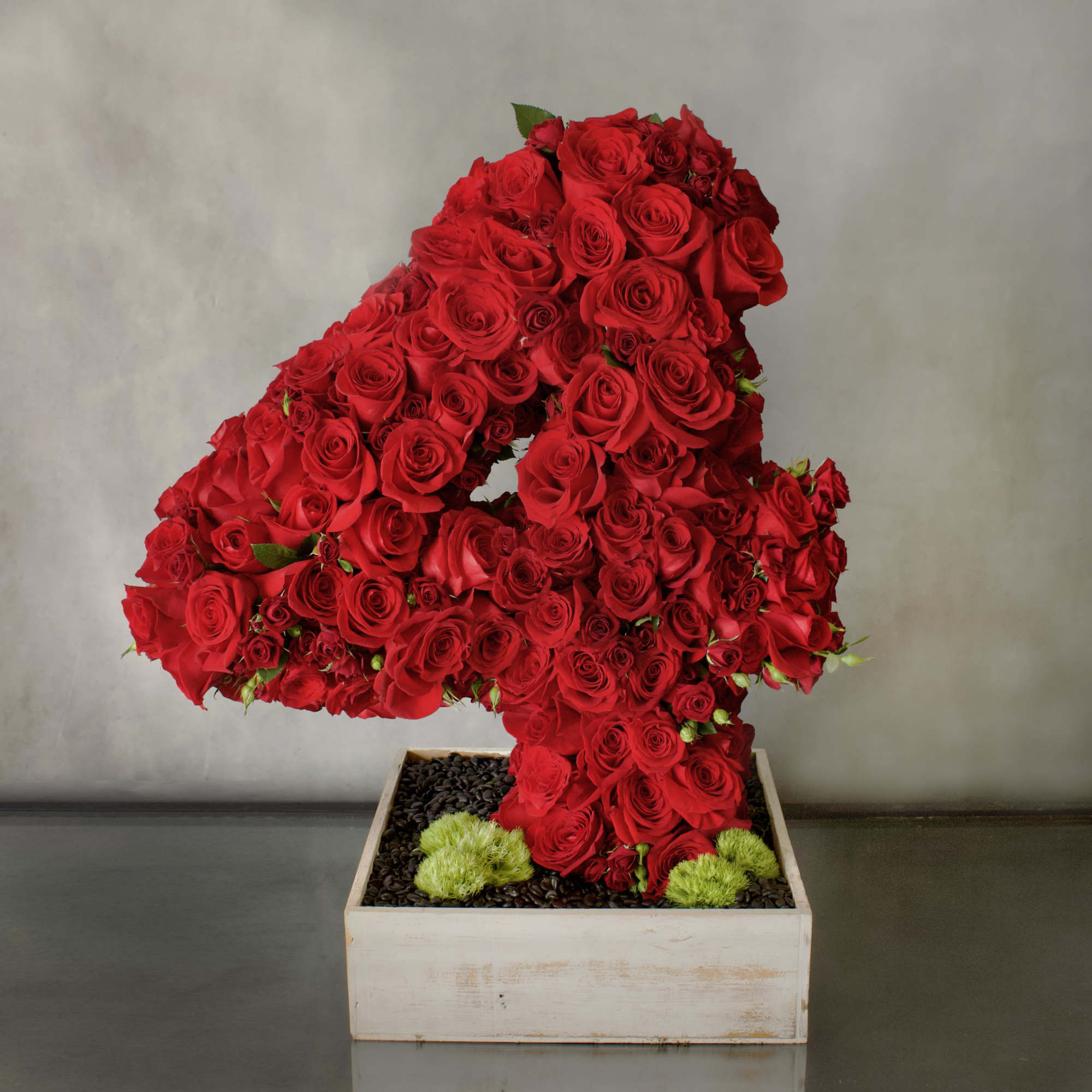 A beautiful number covered in various types of Red Roses, about 200