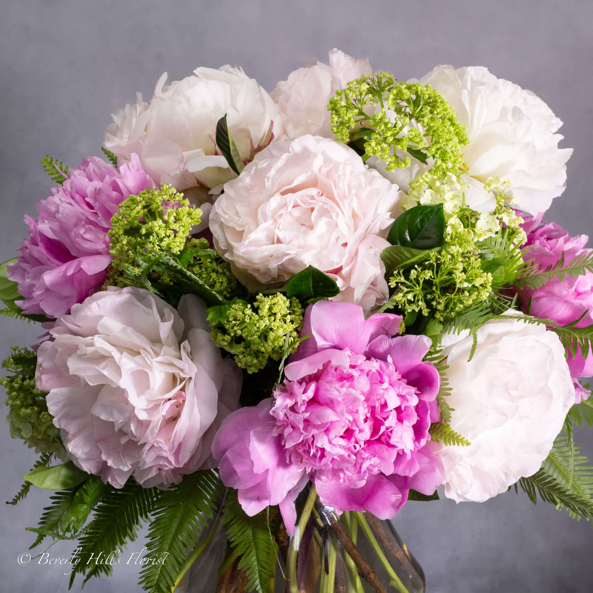 Available for Same-Day Delivery!

Nestled within a sleek vase, the Ethereal Elegance arrangement