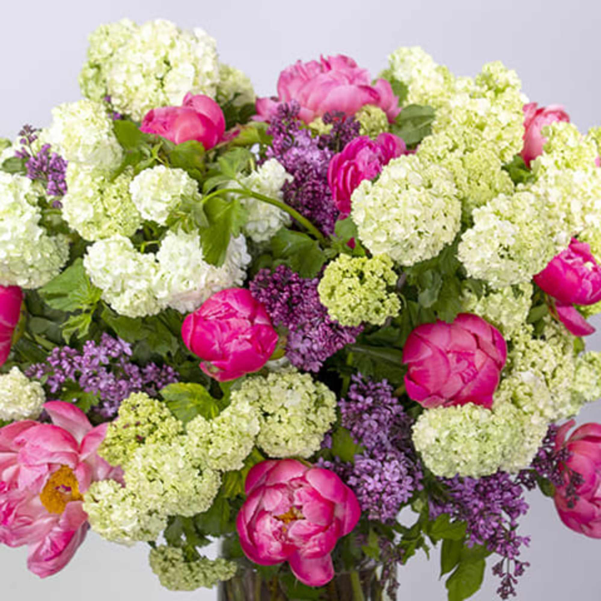 An enchanting globe-shaped floral arrangement exuding delight, joy, and happiness. This radiant