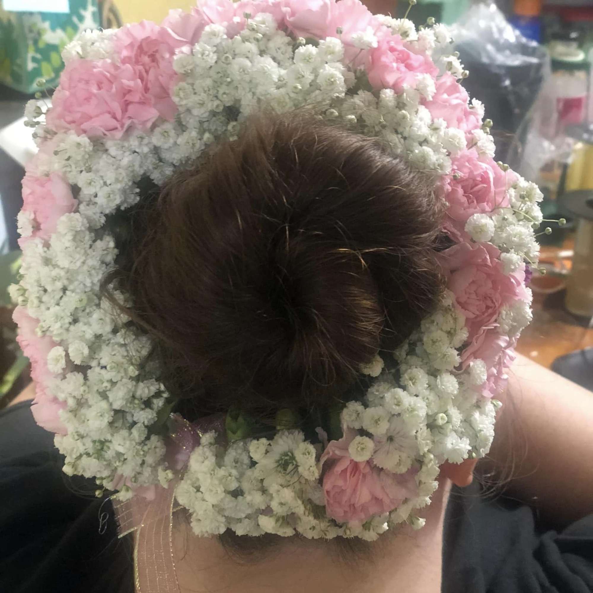 A traditional Indian hair accessory that women wear around their hair bun A traditional Indian hair accessory that women wear around their hair bun