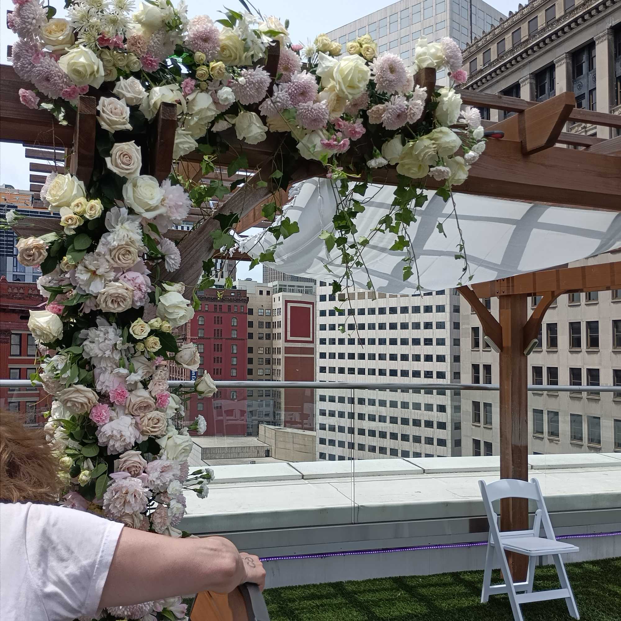 Beautiful white, pink and blush roses, carnations and other flowers huppah decor