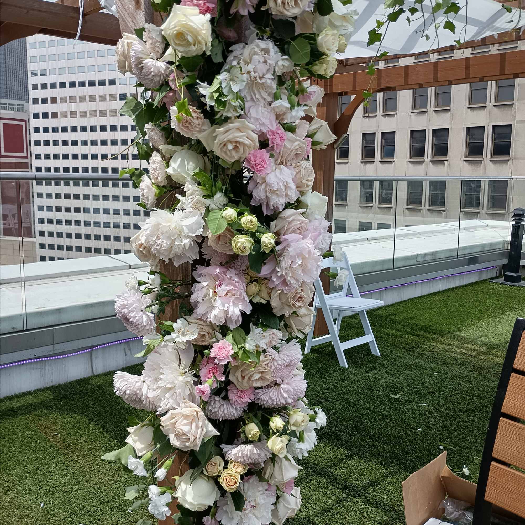 Beautiful white, pink and blush roses, carnations and other flowers huppah decor