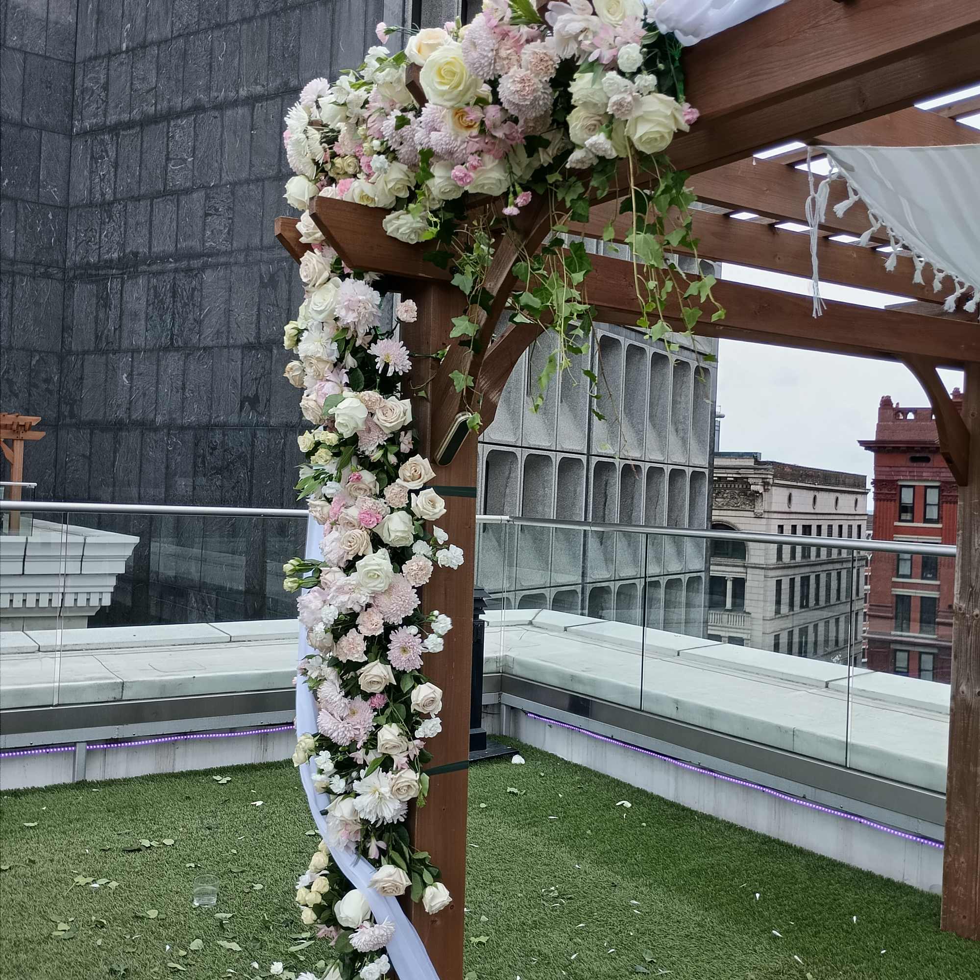 Beautiful white, pink and blush roses, carnations and other flowers huppah decor