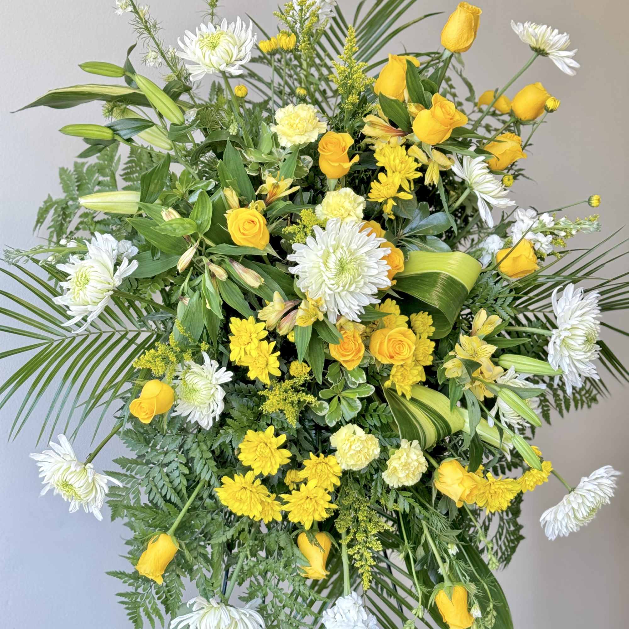 This beautiful spray is arranged with Lillys, cushion mums, lisianthus, white stock This beautiful spray is arranged with Lillys, cushion mums, lisianthus, white stock