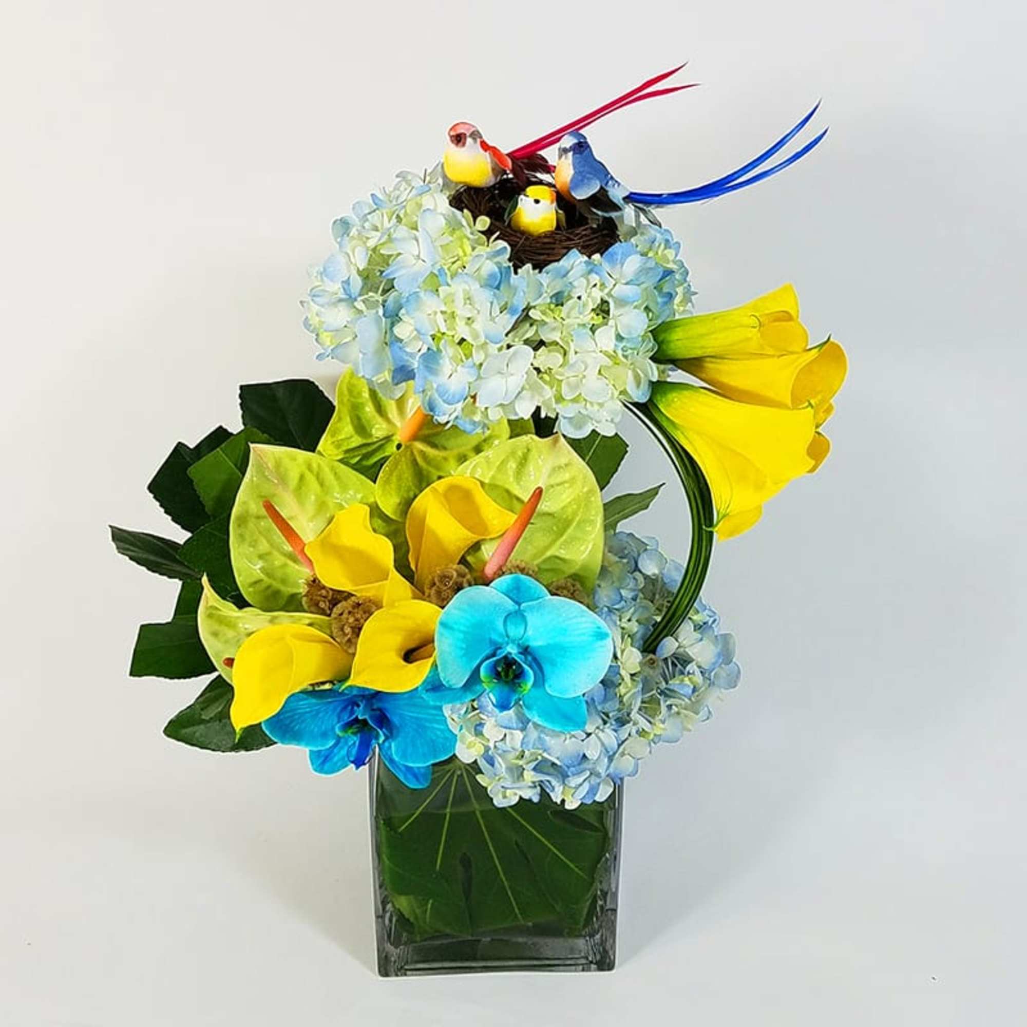 Modern Floral Design in a Glass Vase with Hydrangeas, Anthuriums, Mini-callas, Greens