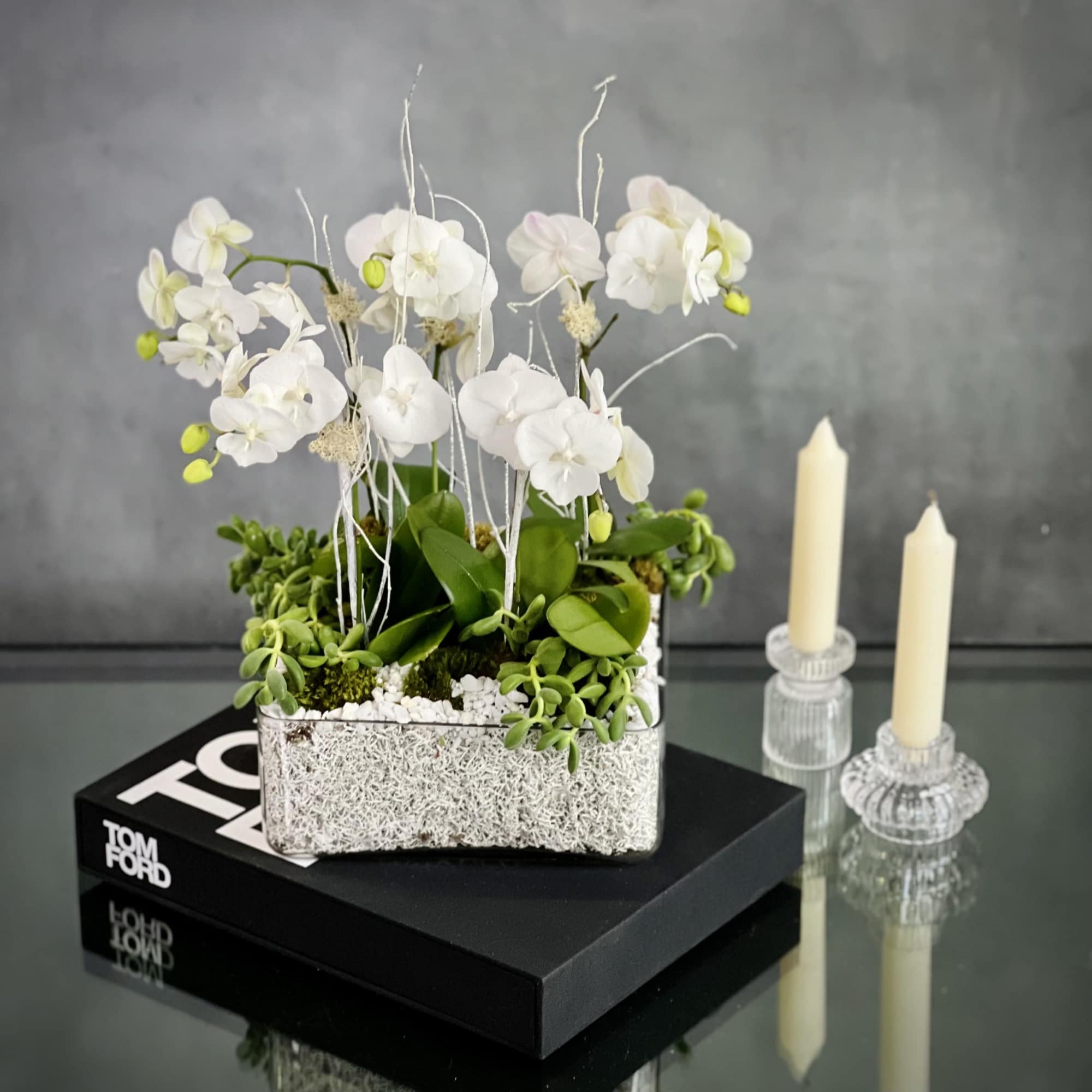 5 White Orchids in a Modern Low profile Square glass container decorated