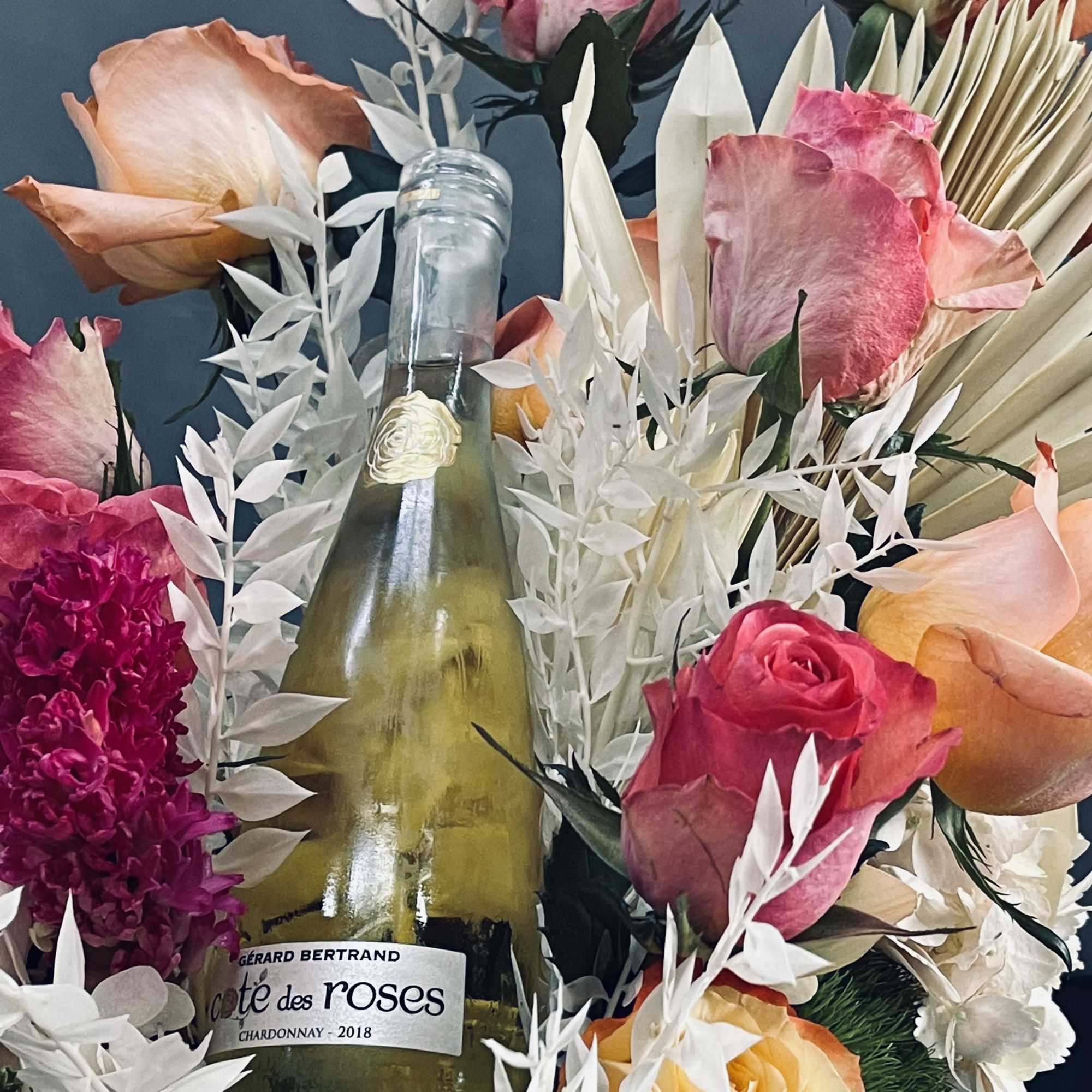 A beautiful presentation of a lovely box of floral which includes, peach