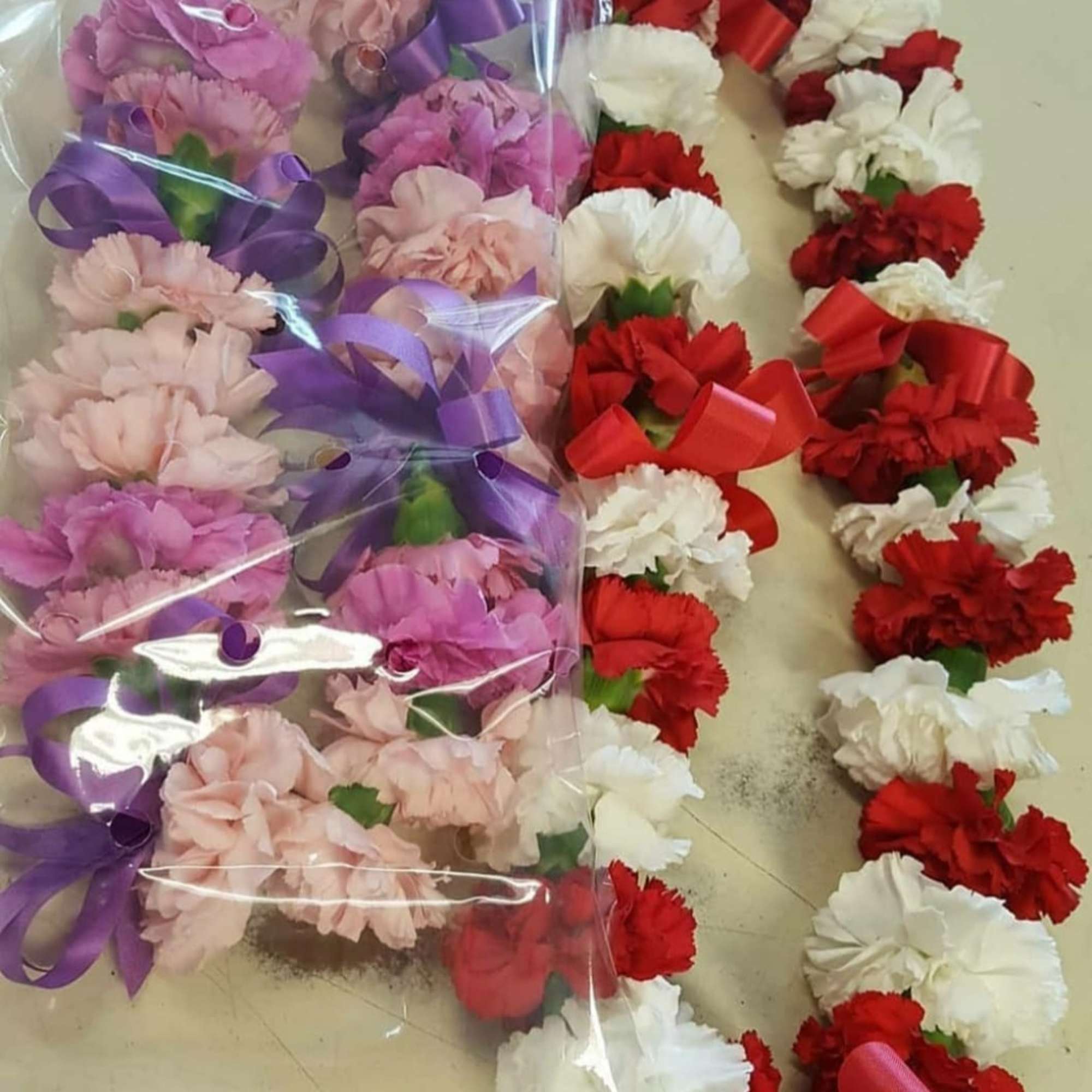 These beautiful carnation leis can be made in two colors -Example -