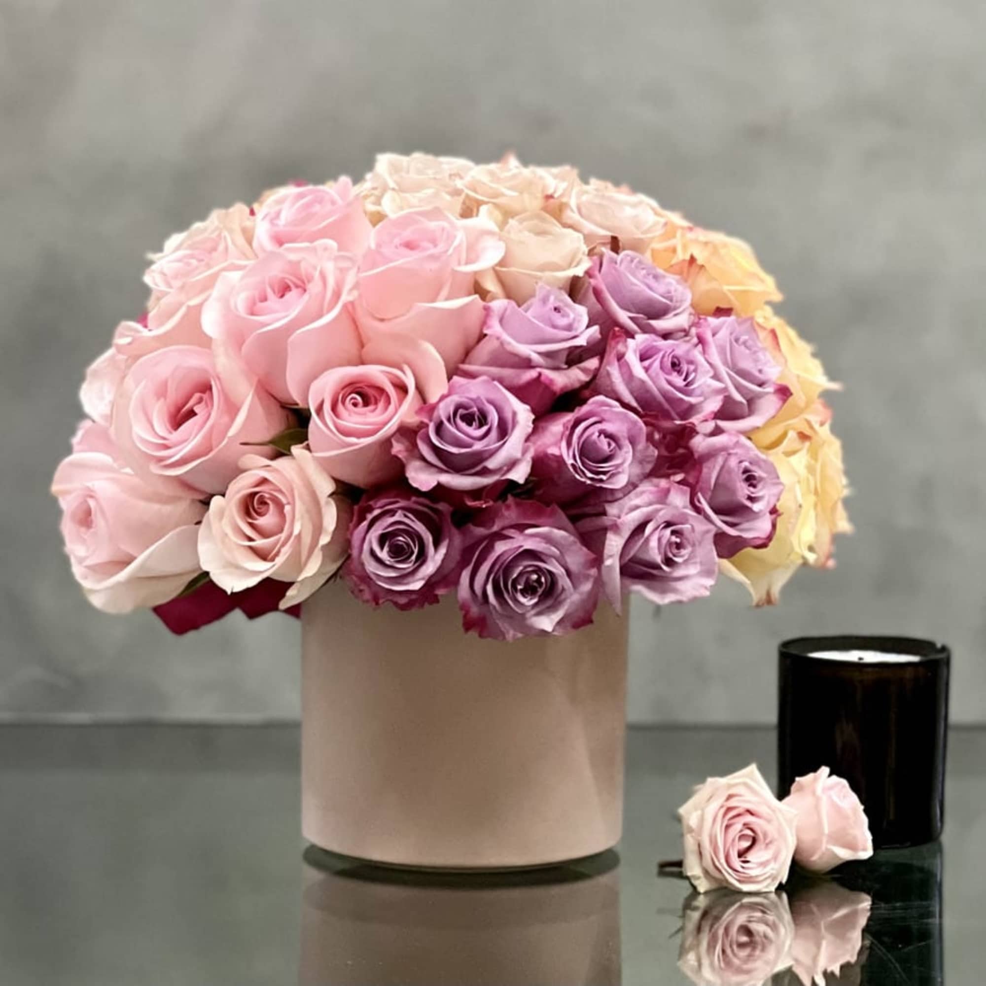Vibrant and beautiful.... this arrangement is artfully created multi-colored Roses combining brights