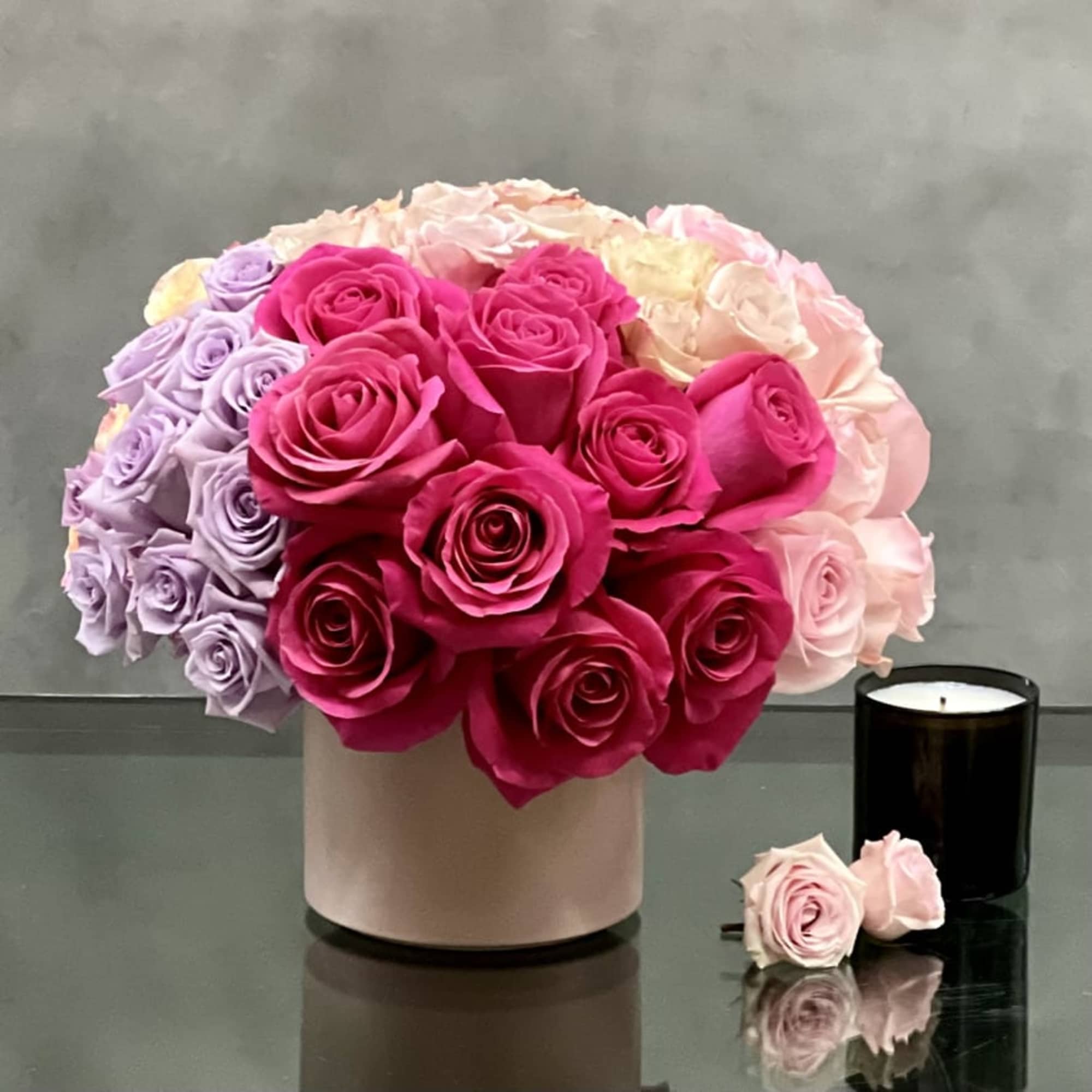 Vibrant and beautiful.... this arrangement is artfully created multi-colored Roses combining brights