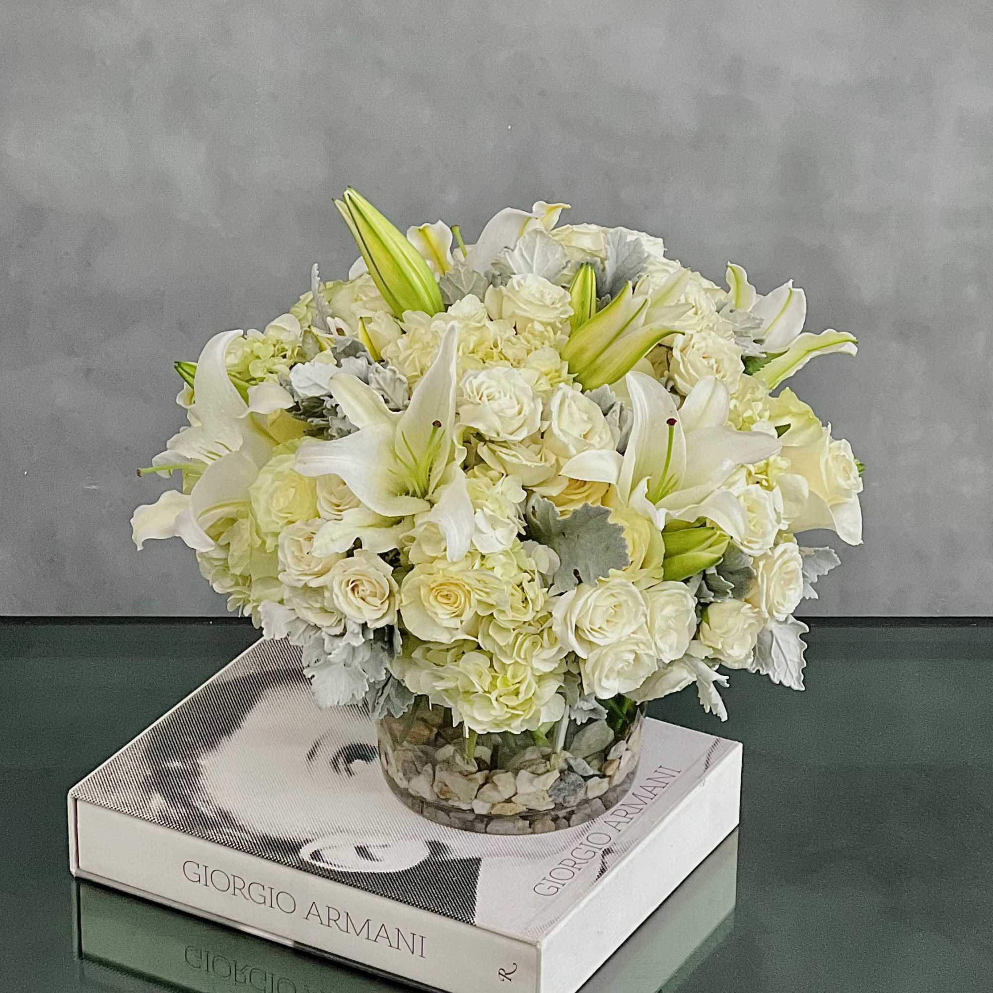 This dreamy white floral mix is heavenly. The cylinder glass vase holds