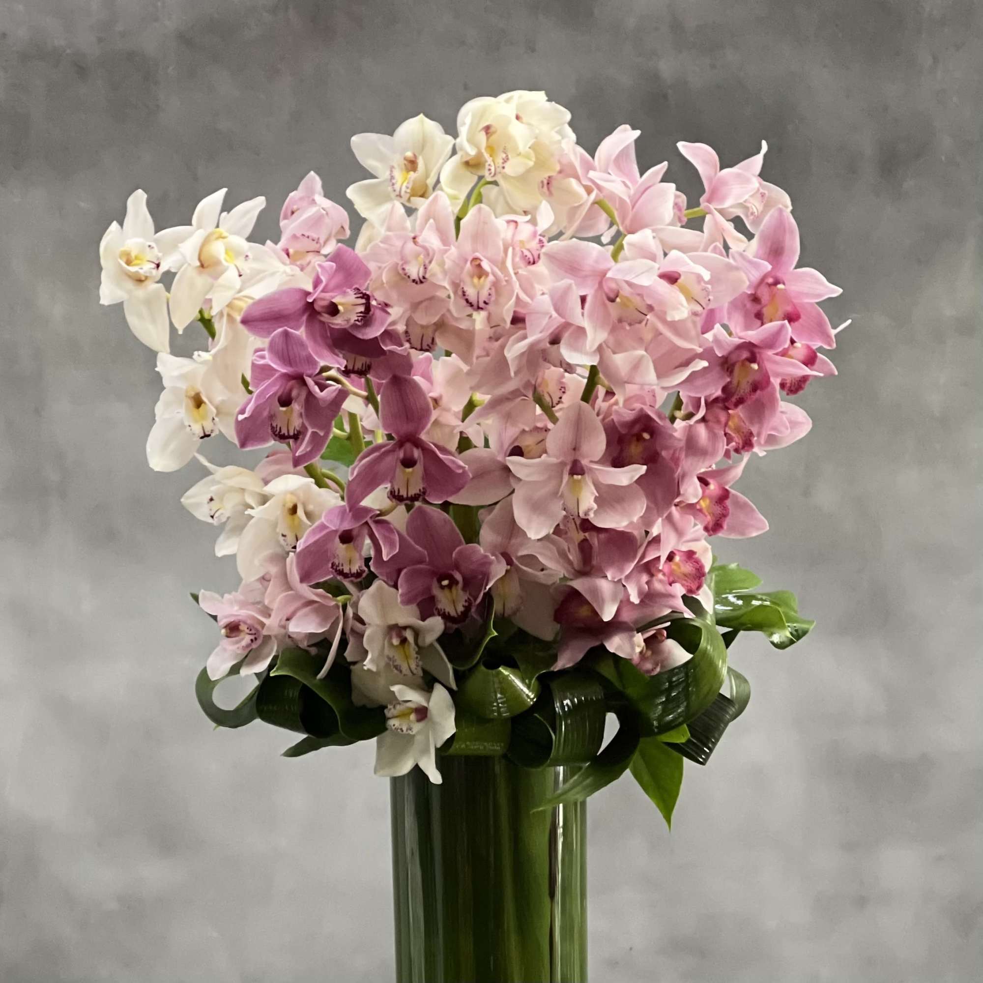 Deliver happiness and joy with this magnificent floral design that features a