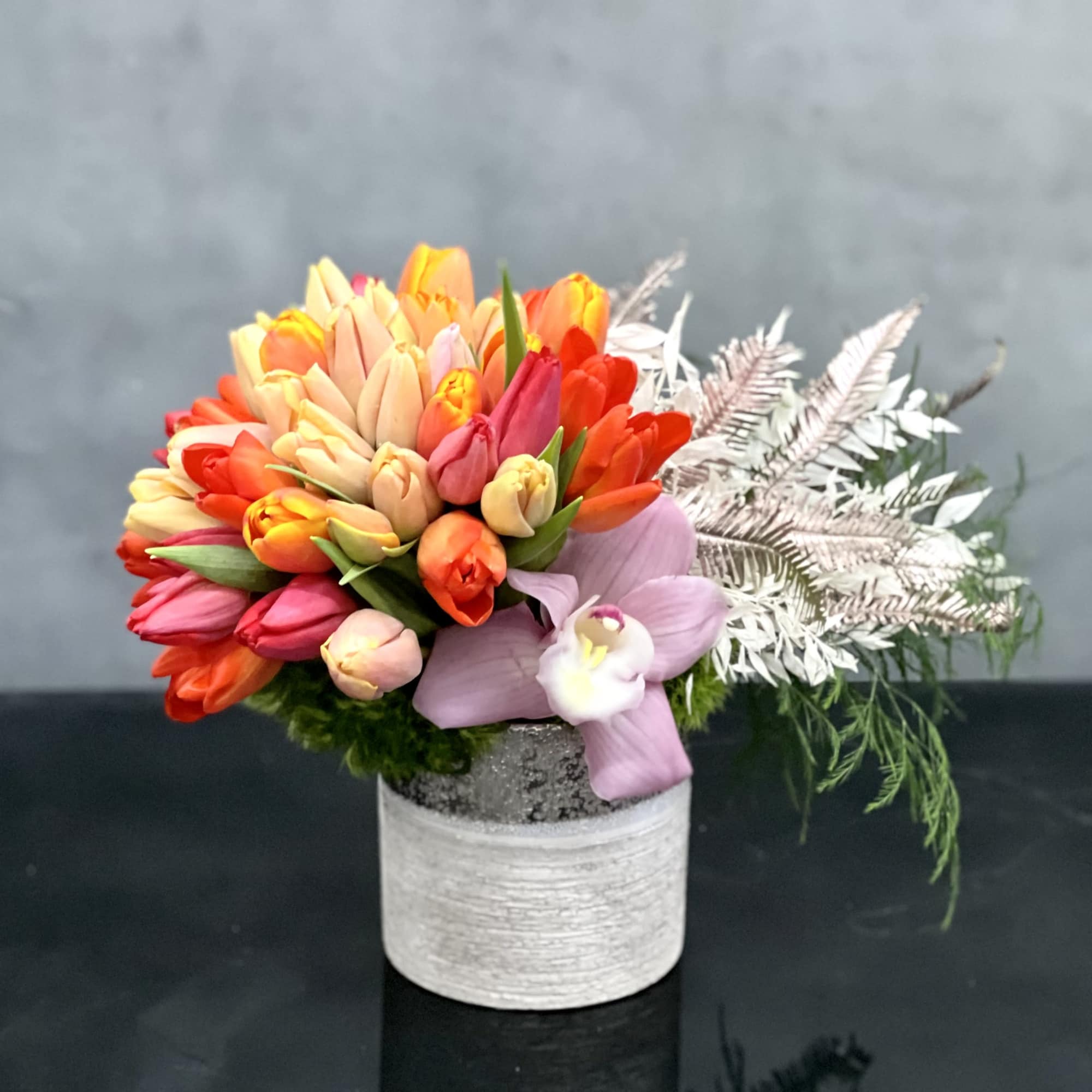 Fill your loved ones day with color! This beautiful Tulip arrangement with