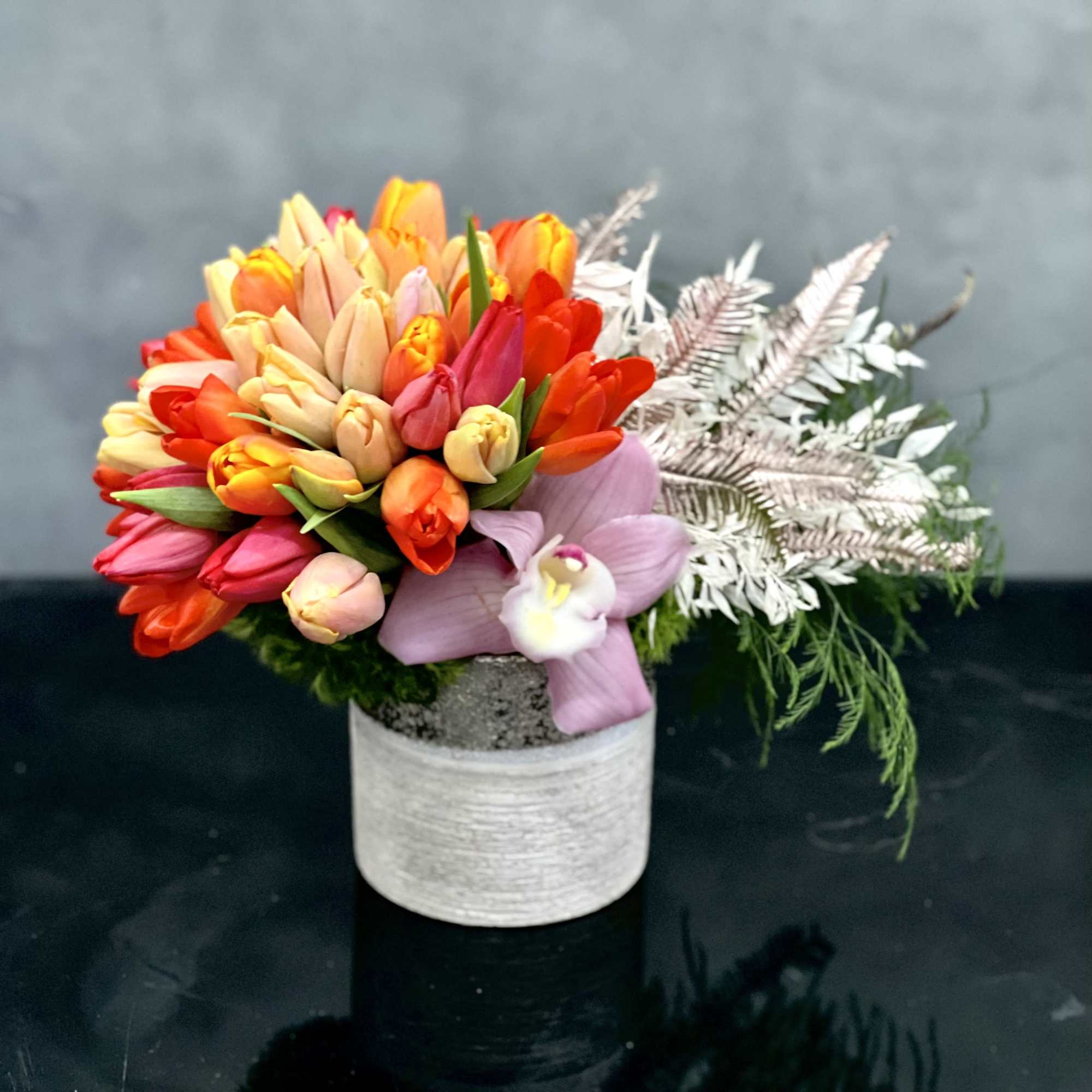 Fill your loved ones day with color! This beautiful Tulip arrangement with