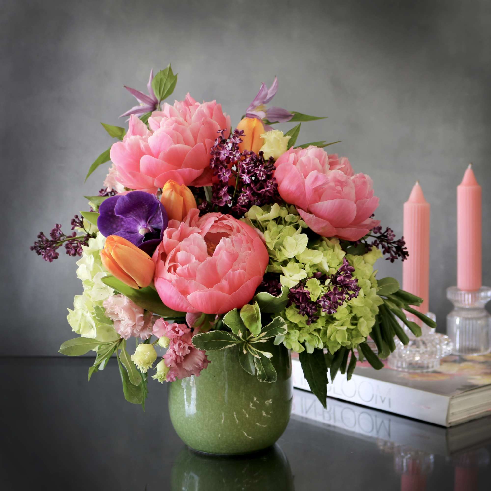 A beautiful floral arrangement in a 5-inch ceramic vase with an overall